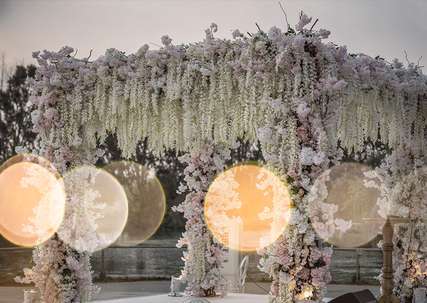 Luxurious floral wedding chuppah in Israel decorated with cascading flowers