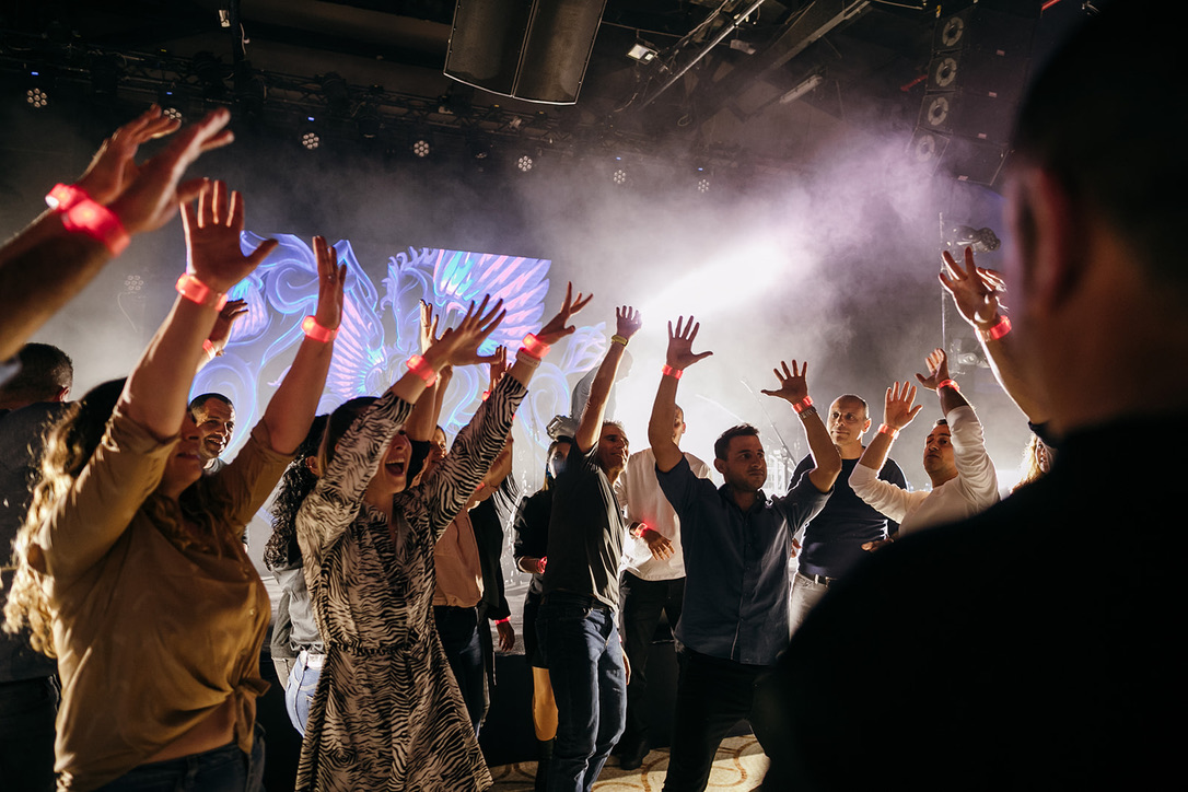 Crowd dancing with wristbands