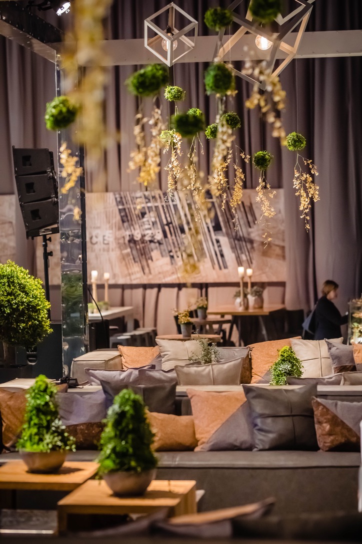 Elegant lounge seating with hanging greenery and modern décor at Gav-Yam 90th anniversary event.