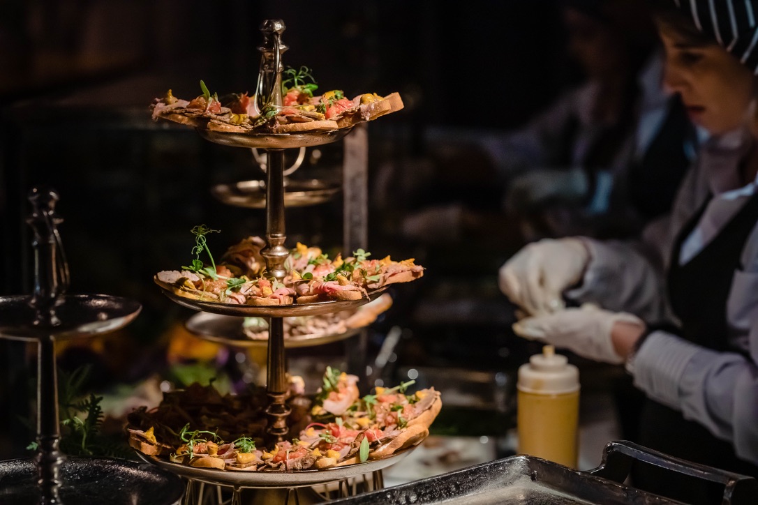 Elegant food display with gourmet appetizers served at Gav-Yam 90th anniversary event.