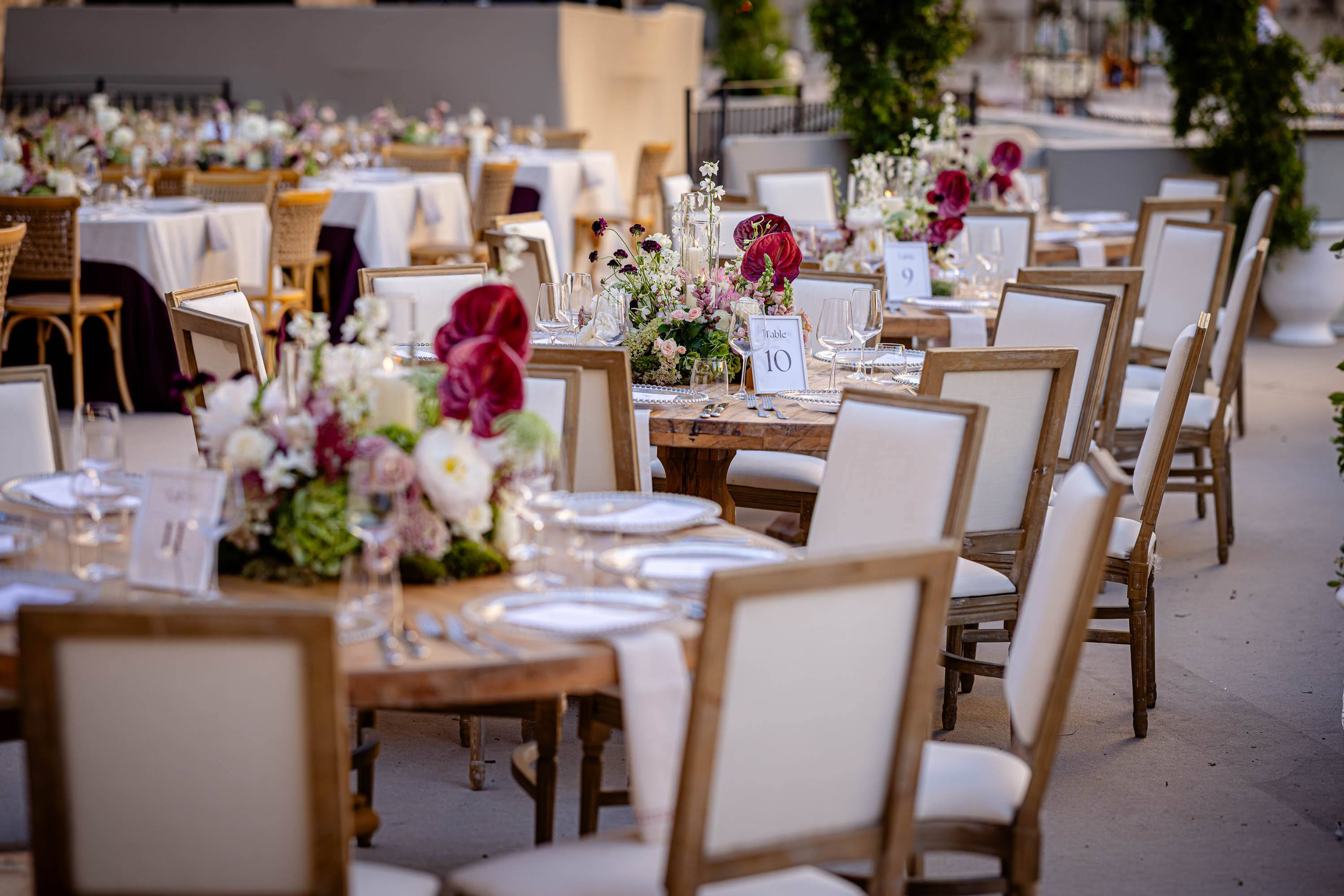 Elegant wedding reception tables with floral centerpieces and refined place settings at the Tower of David in Jerusalem.