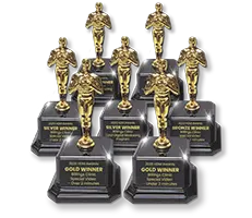 Six gold, silver, and bronze 2025 HDM Awards trophies for Billings Clinic digital marketing and special video projects.