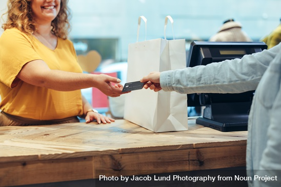 Photo of Shopper Paying For Her Purchases With Credit Card 
