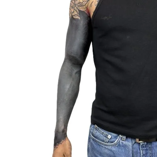 Blackout tattoo on arm