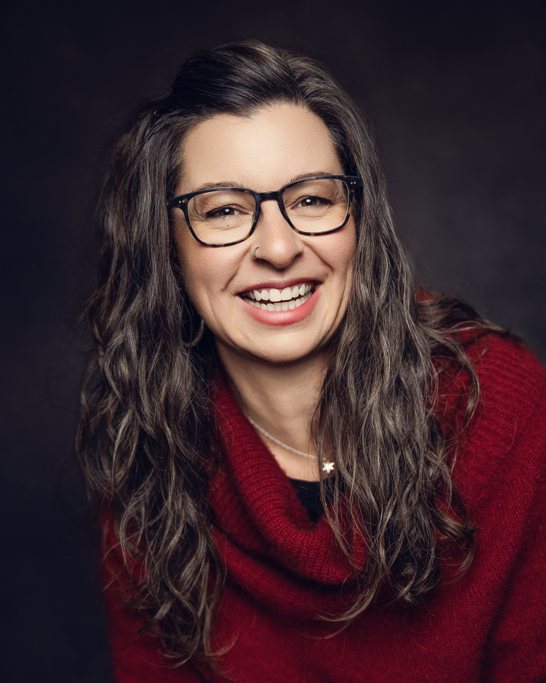 A portrait of Alanna Thompson, RMT, smiling warmly.