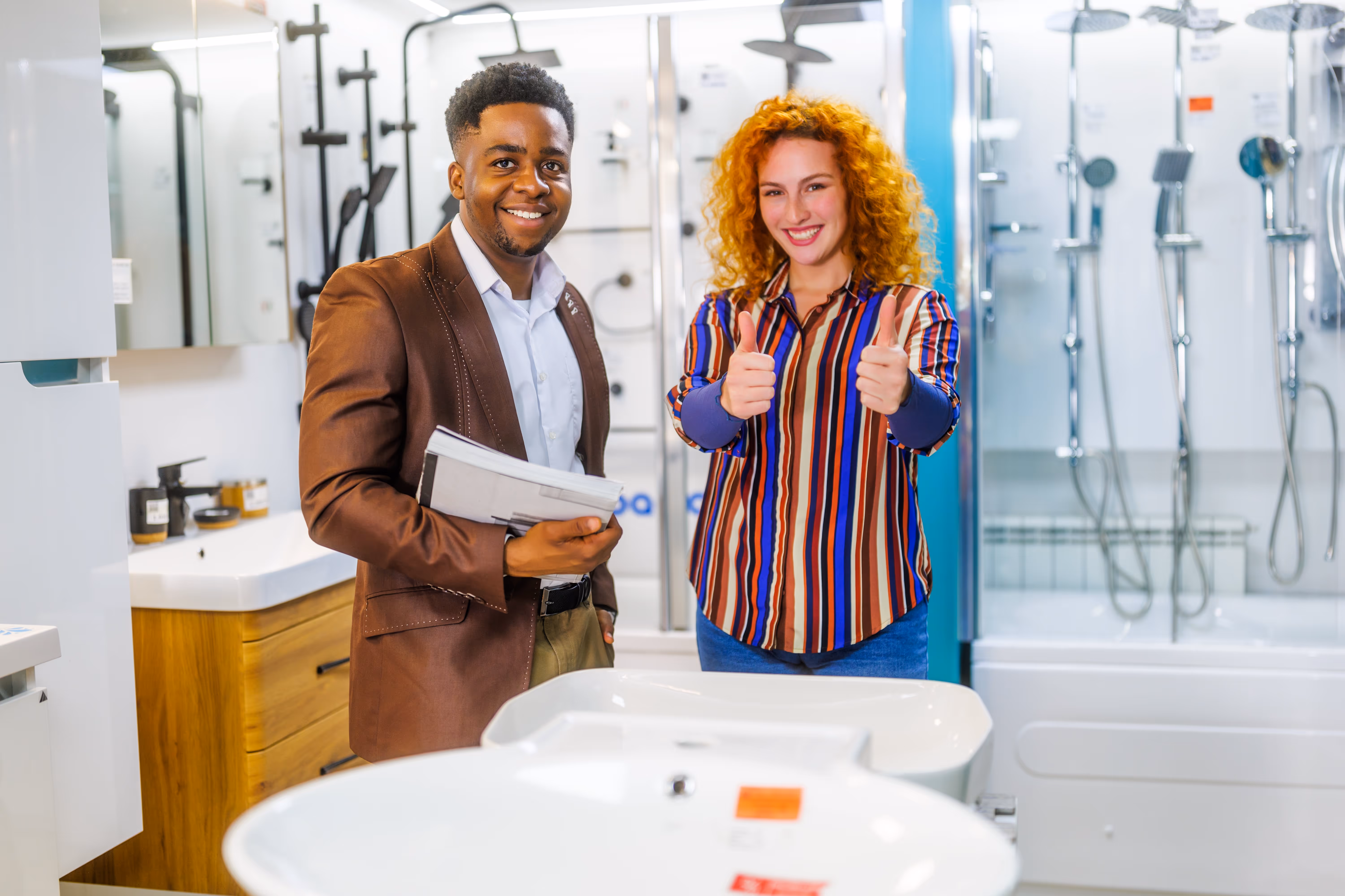 Two people in a bathroom store.