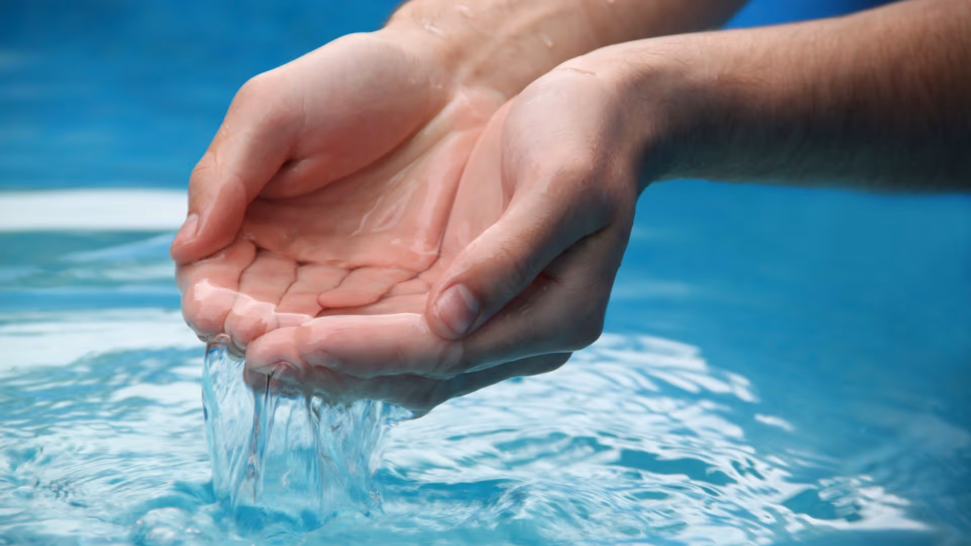Hands holding up water
