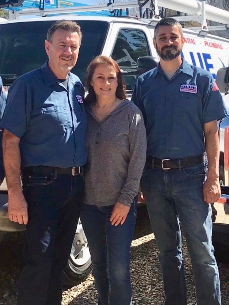 A photo of Blue Plumbing owners and staff.