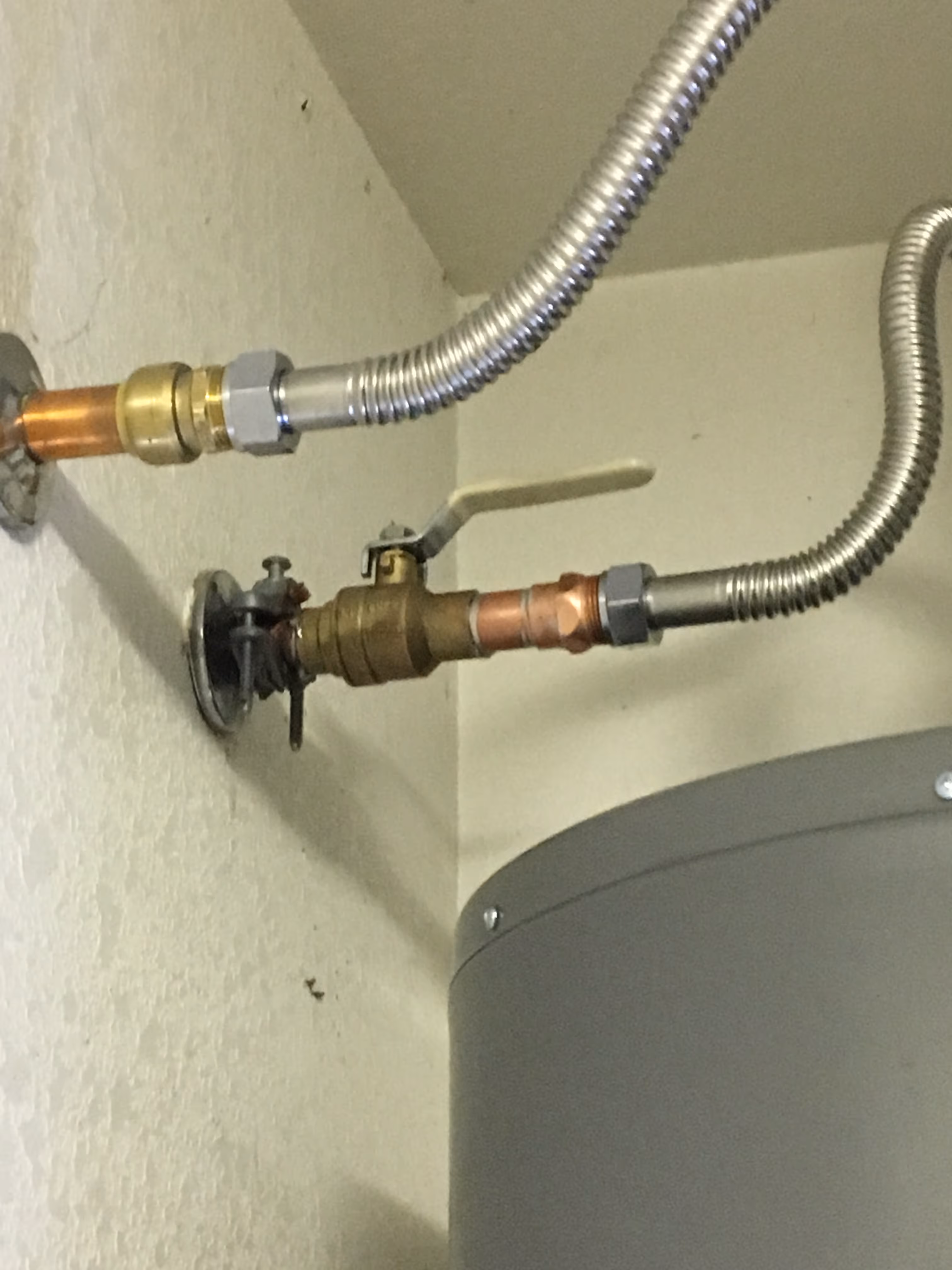 A valve next to water heater.