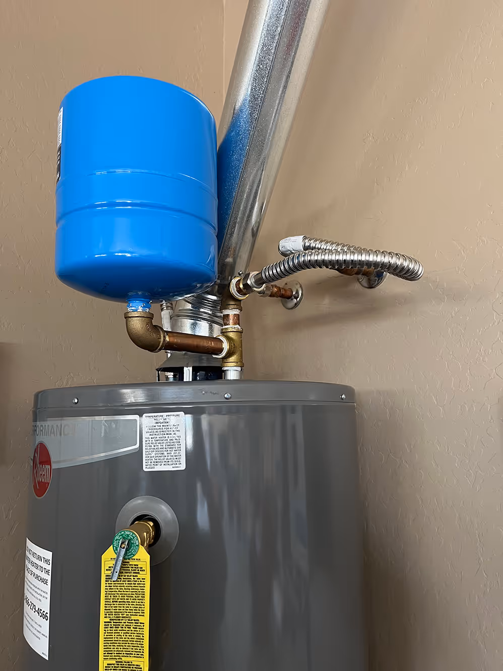Water heater with expansion tank on top