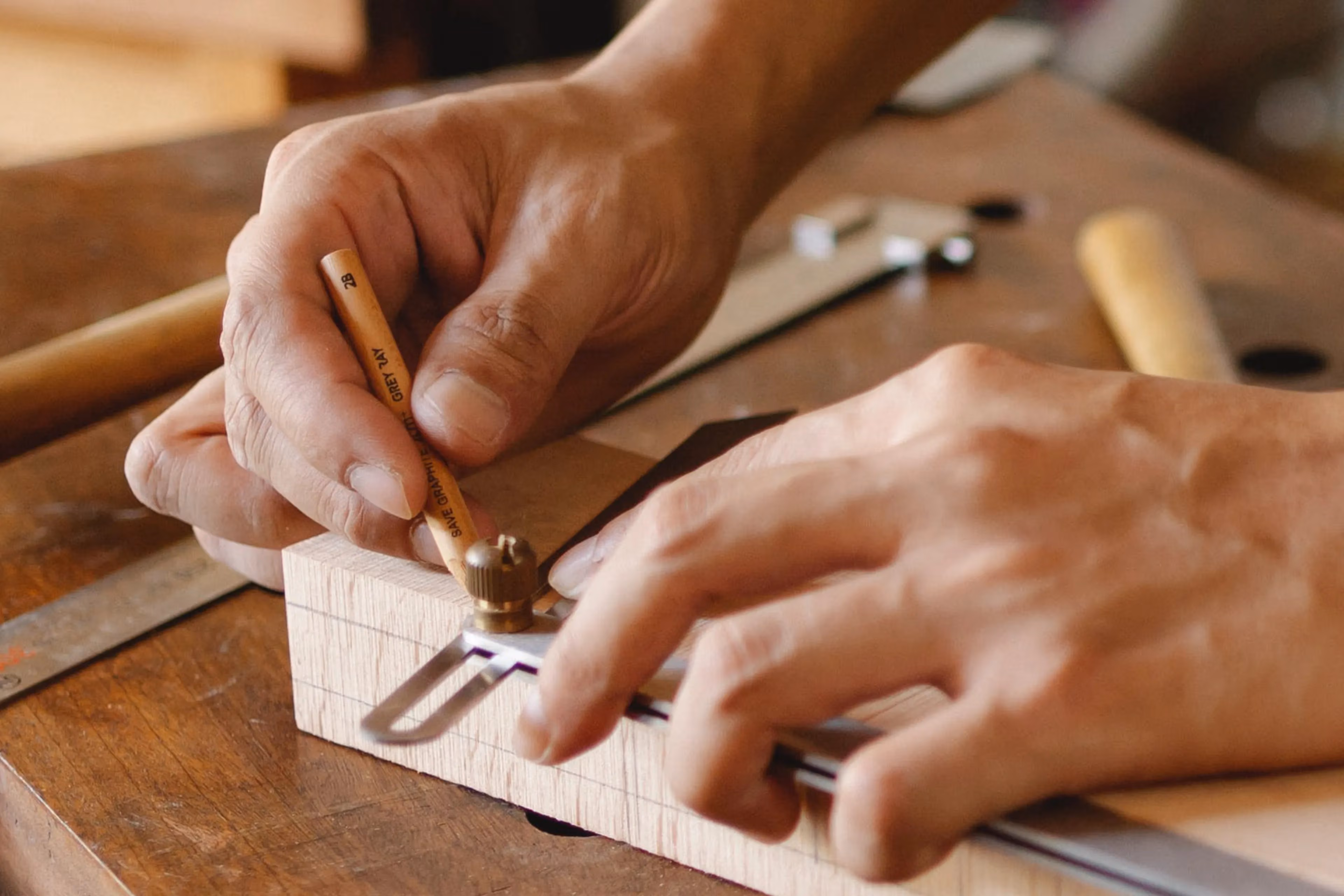A pair of hands working on a custom carpentry project