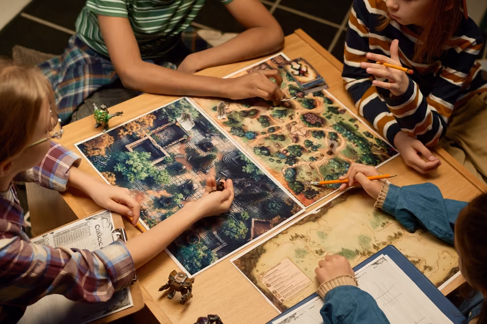 Group of kids playing tabletop role-playing game with maps, miniatures, pencils, and character sheets.