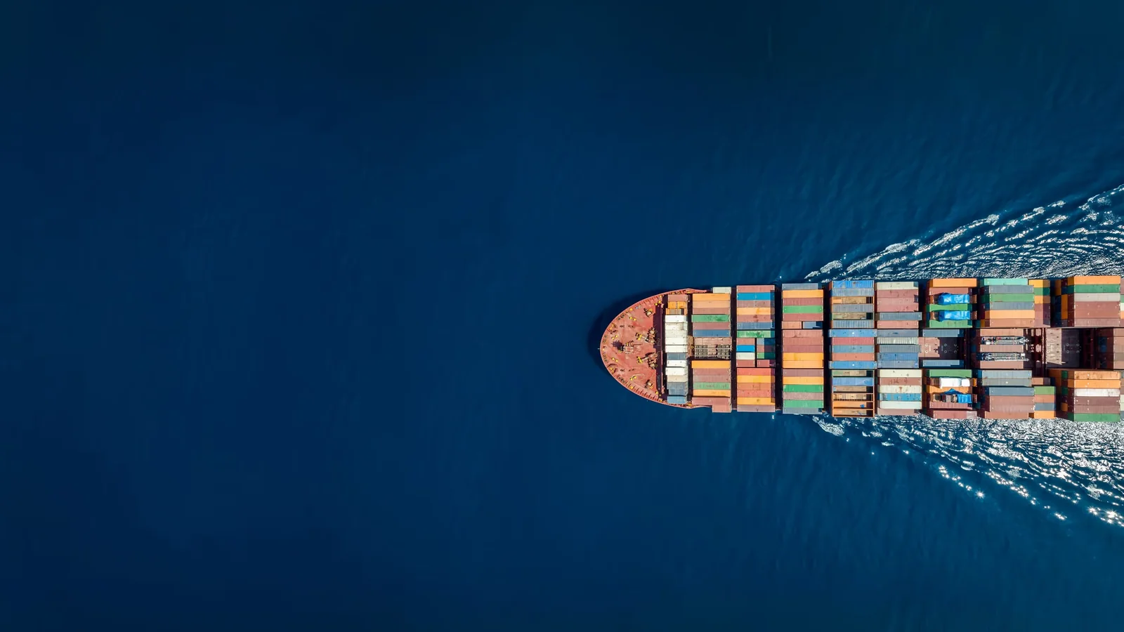 Cargo ship carrying containers at sea.