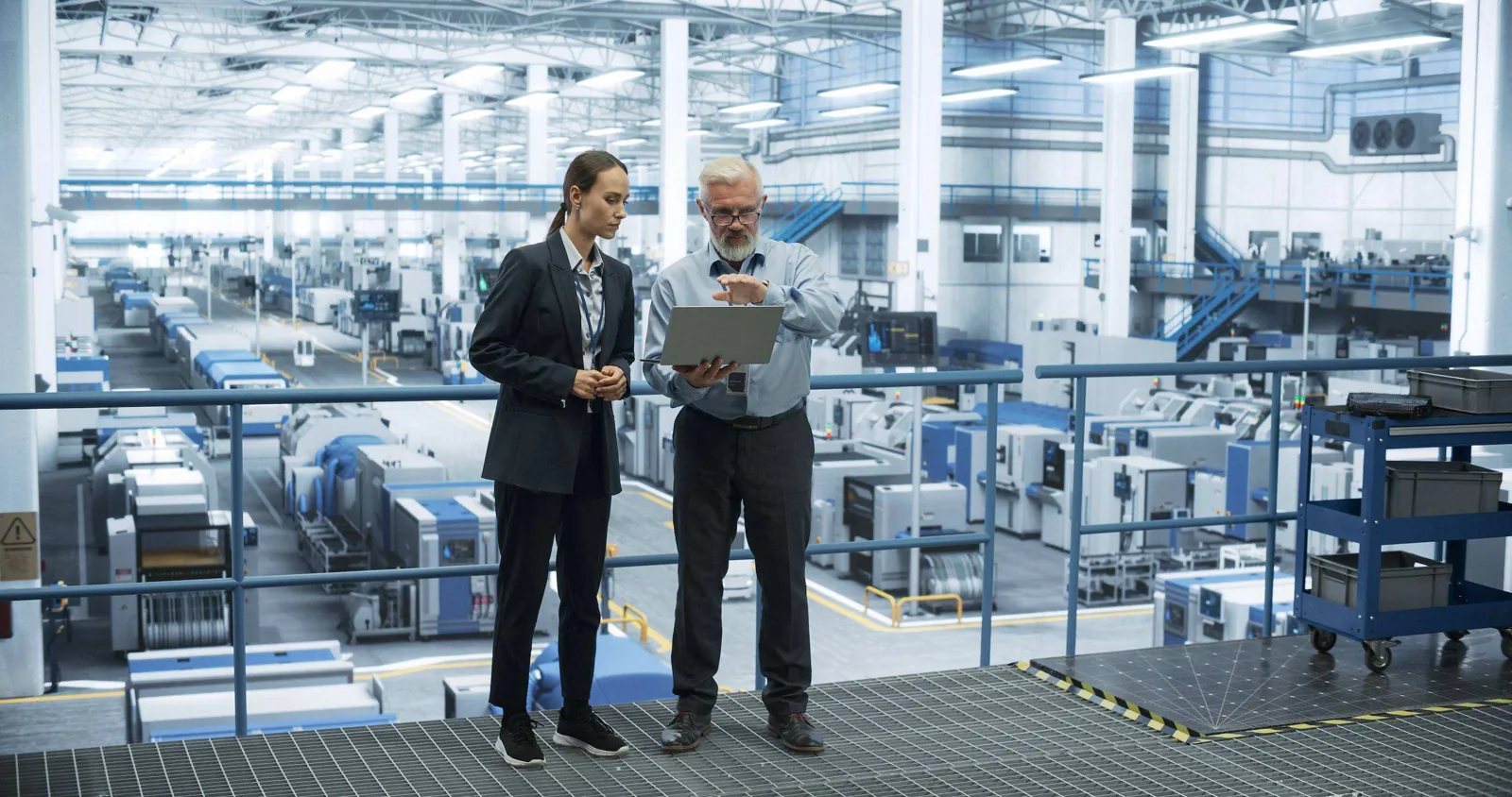 Factory managers with tablet.
