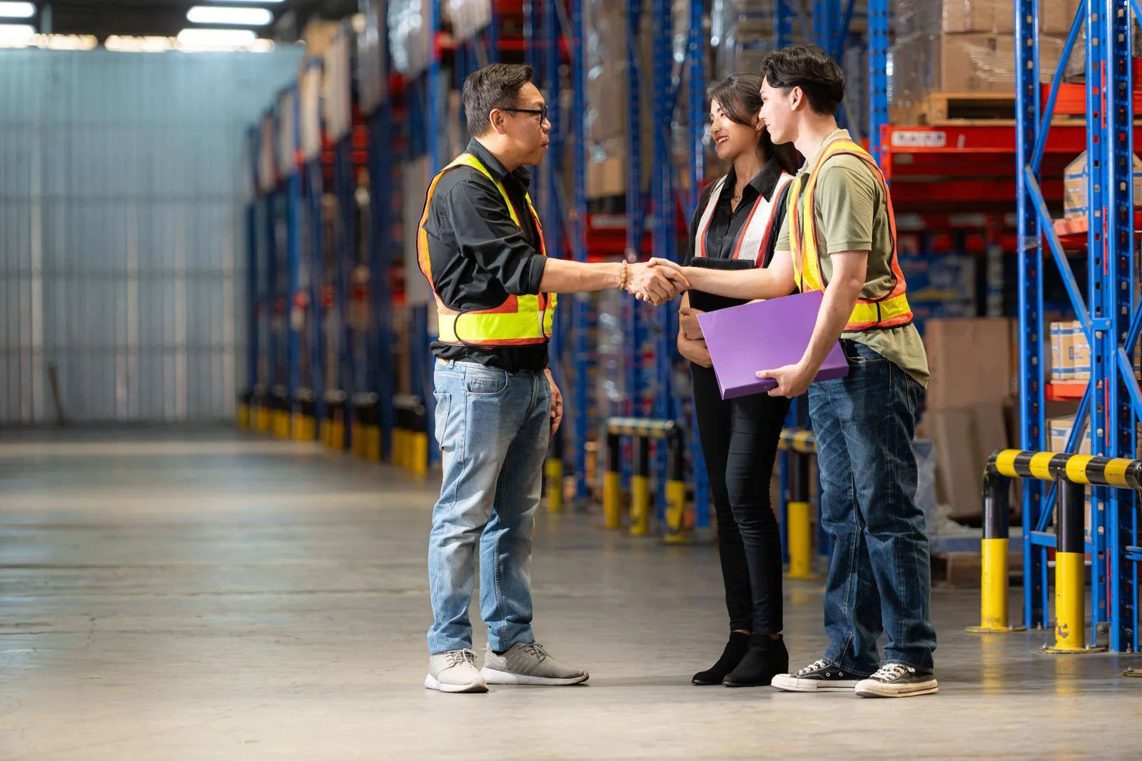 Warehouse staff talking.