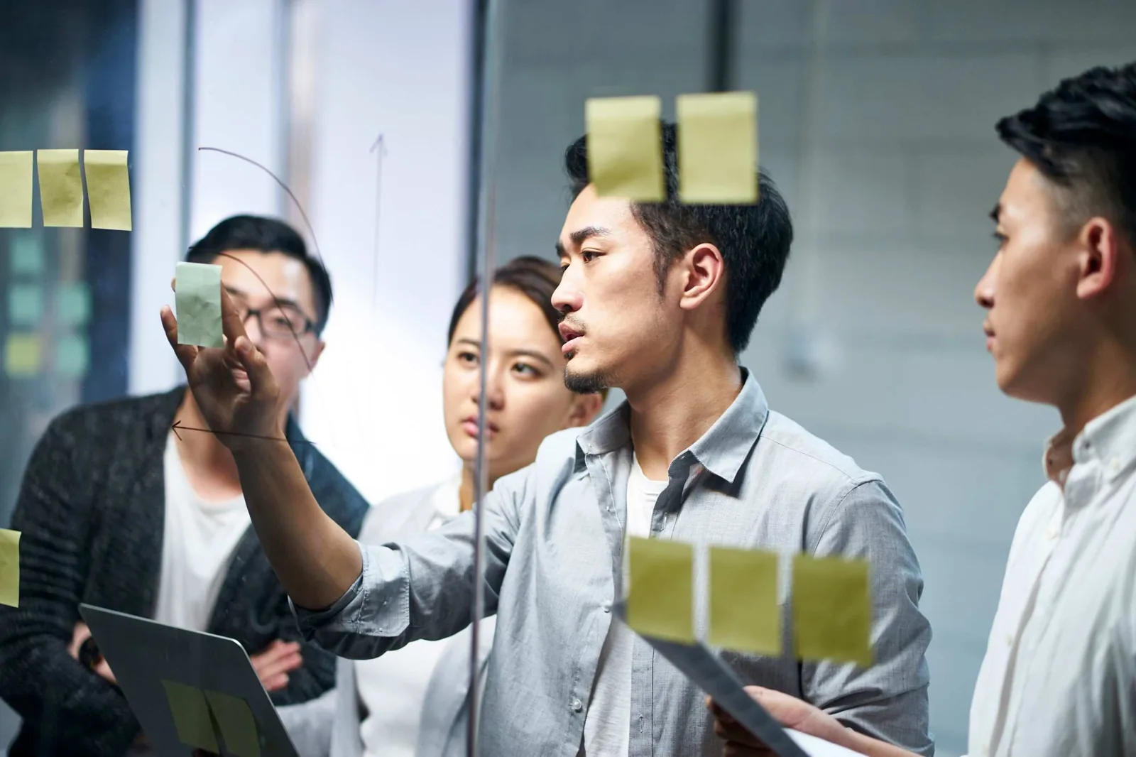 Business team with sticky notes.