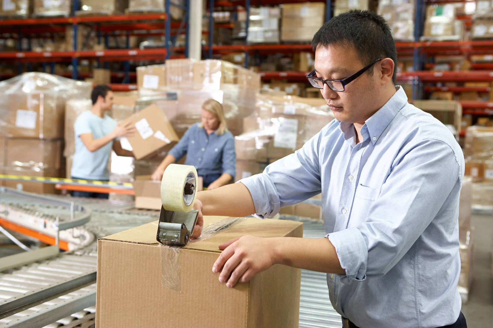 Worker packing carton.