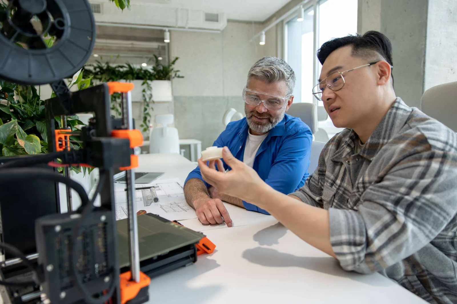 Engineer explaining prototype.