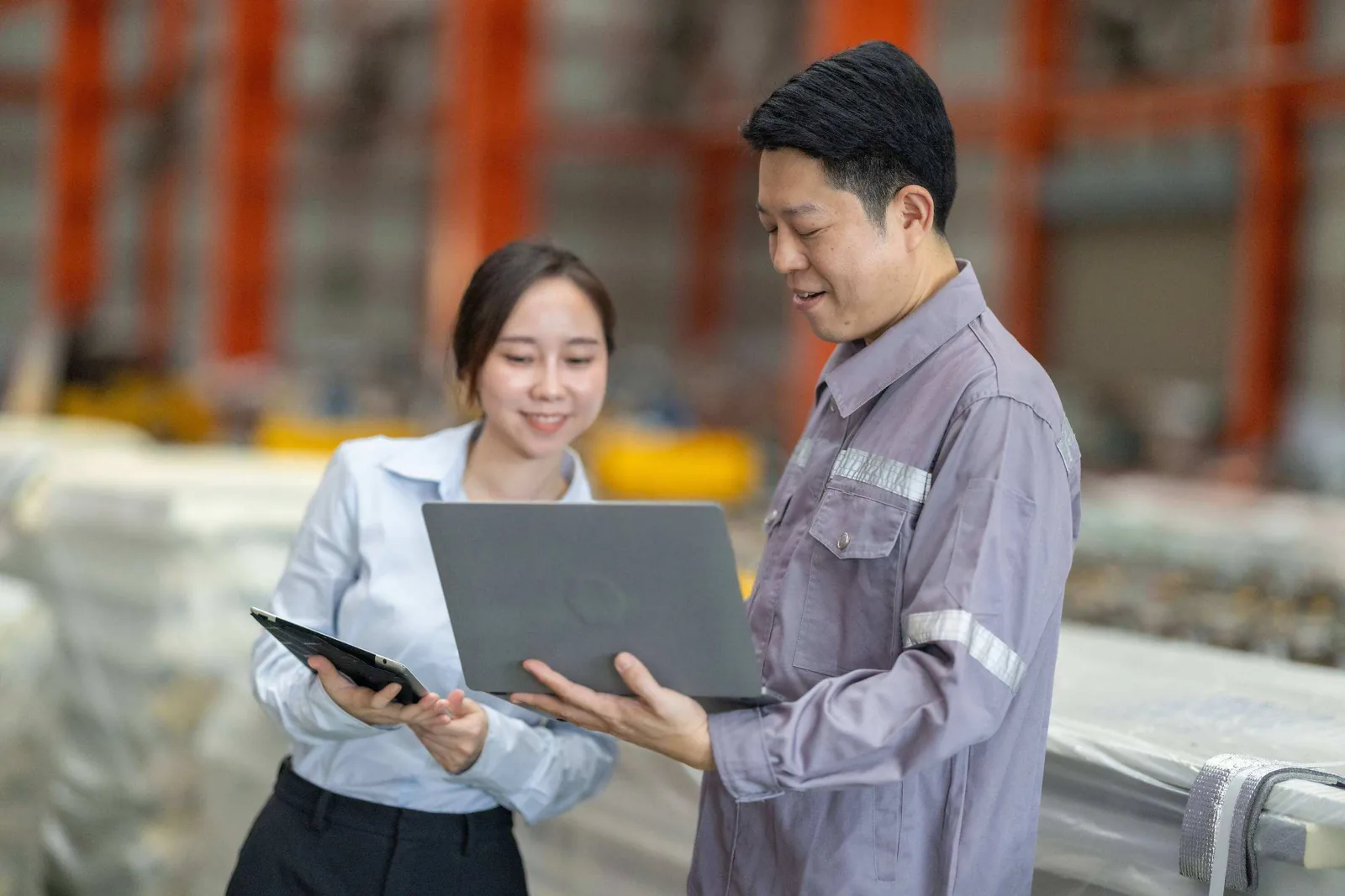 Factory workers with tablet.