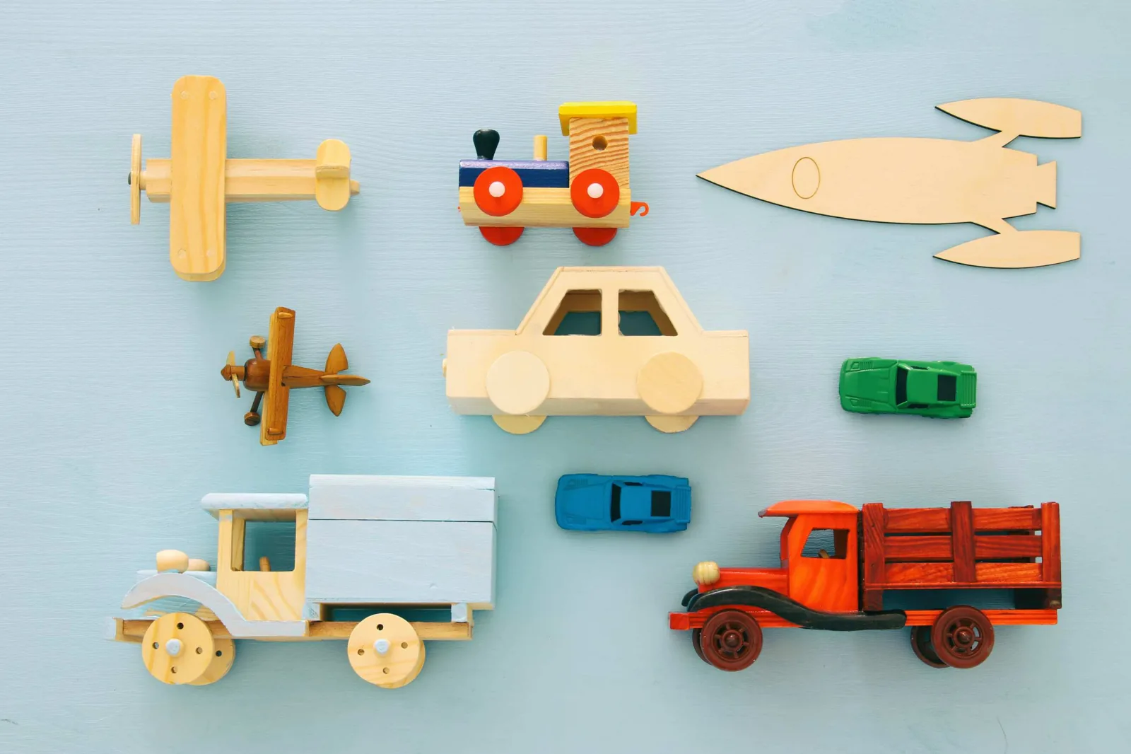 Wooden toy vehicles.