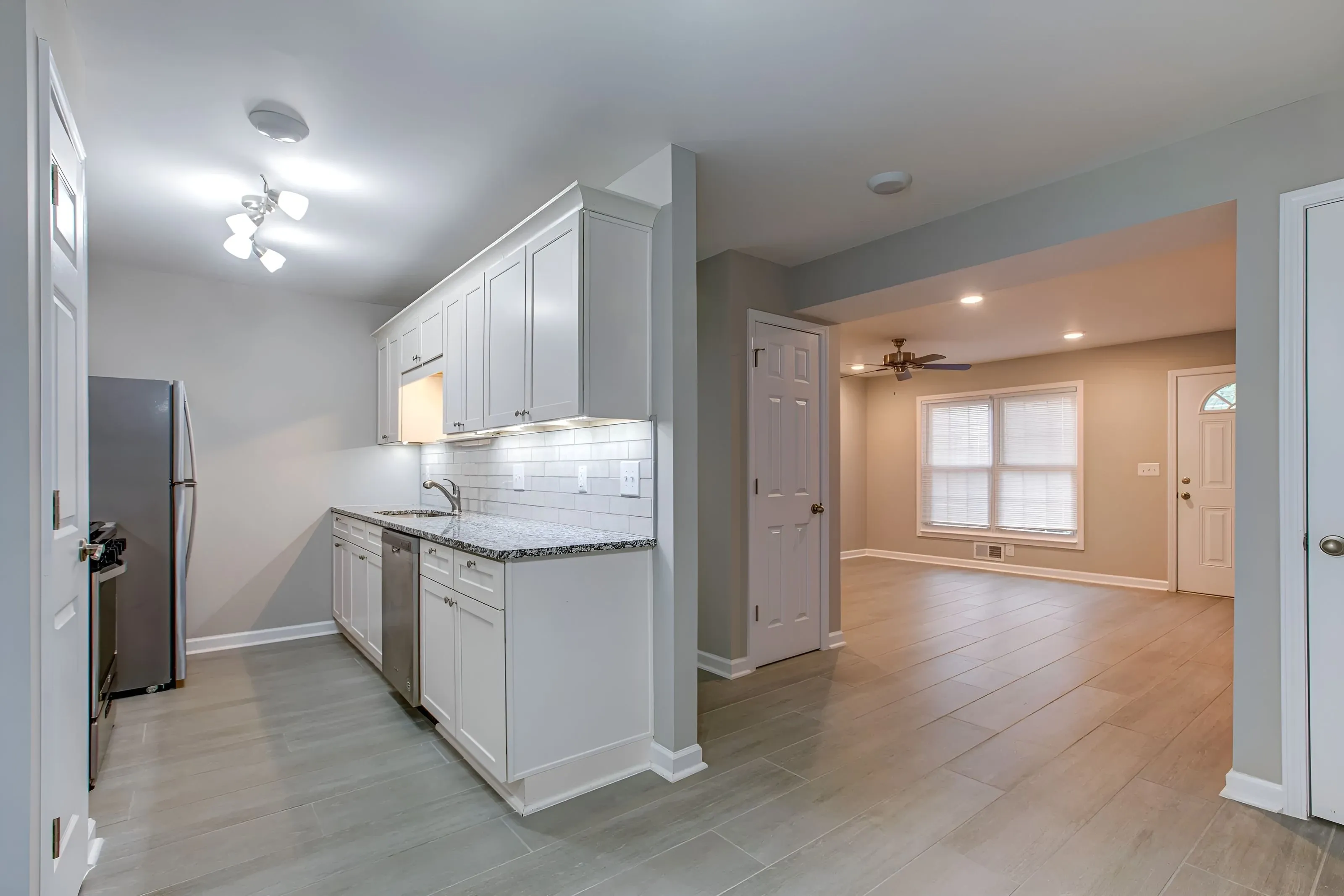 Modern kitchen with breakfast bar at The Ridge Apartments in Marietta, GA.