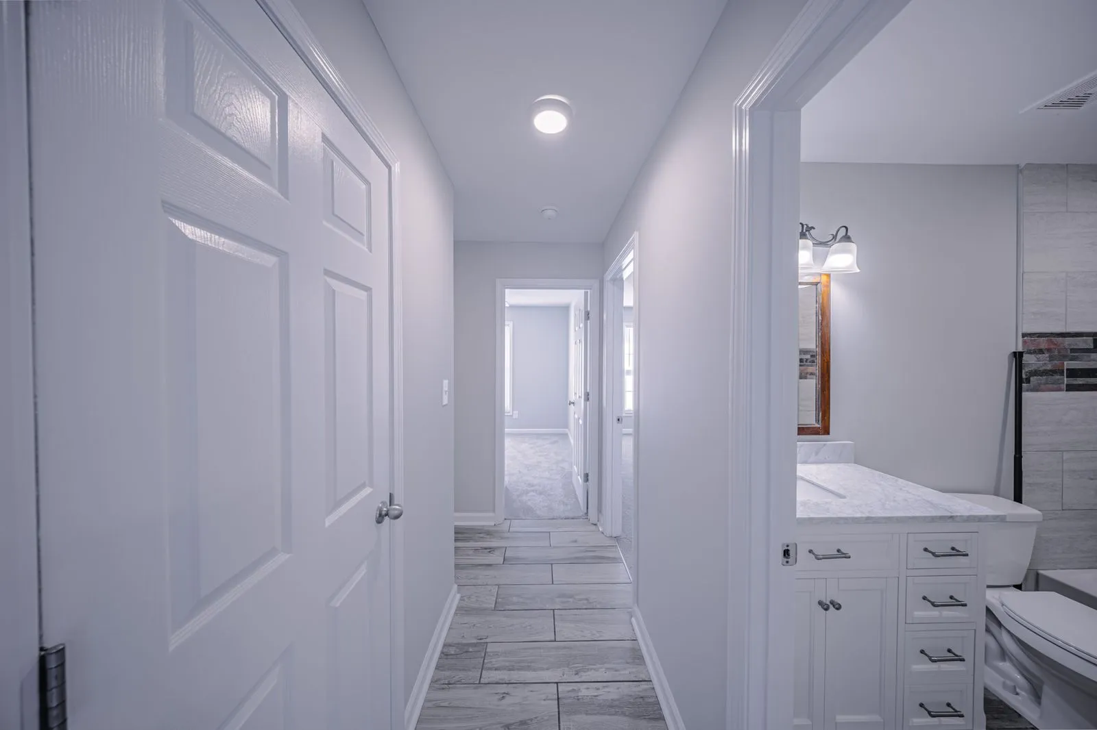 Hallway corridor with original hardwood flooring at The Ridge Apartments in Marietta, GA