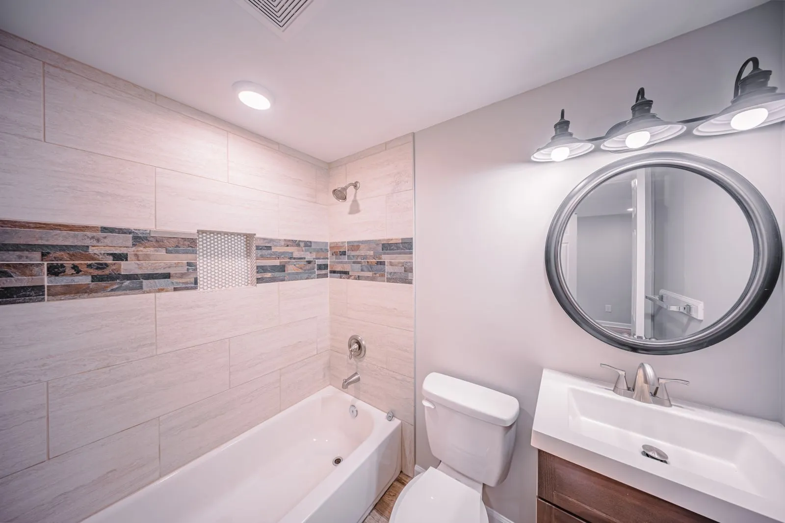 Renovated bathroom with walk-in shower in The Ridge Apartments model in Marietta, GA