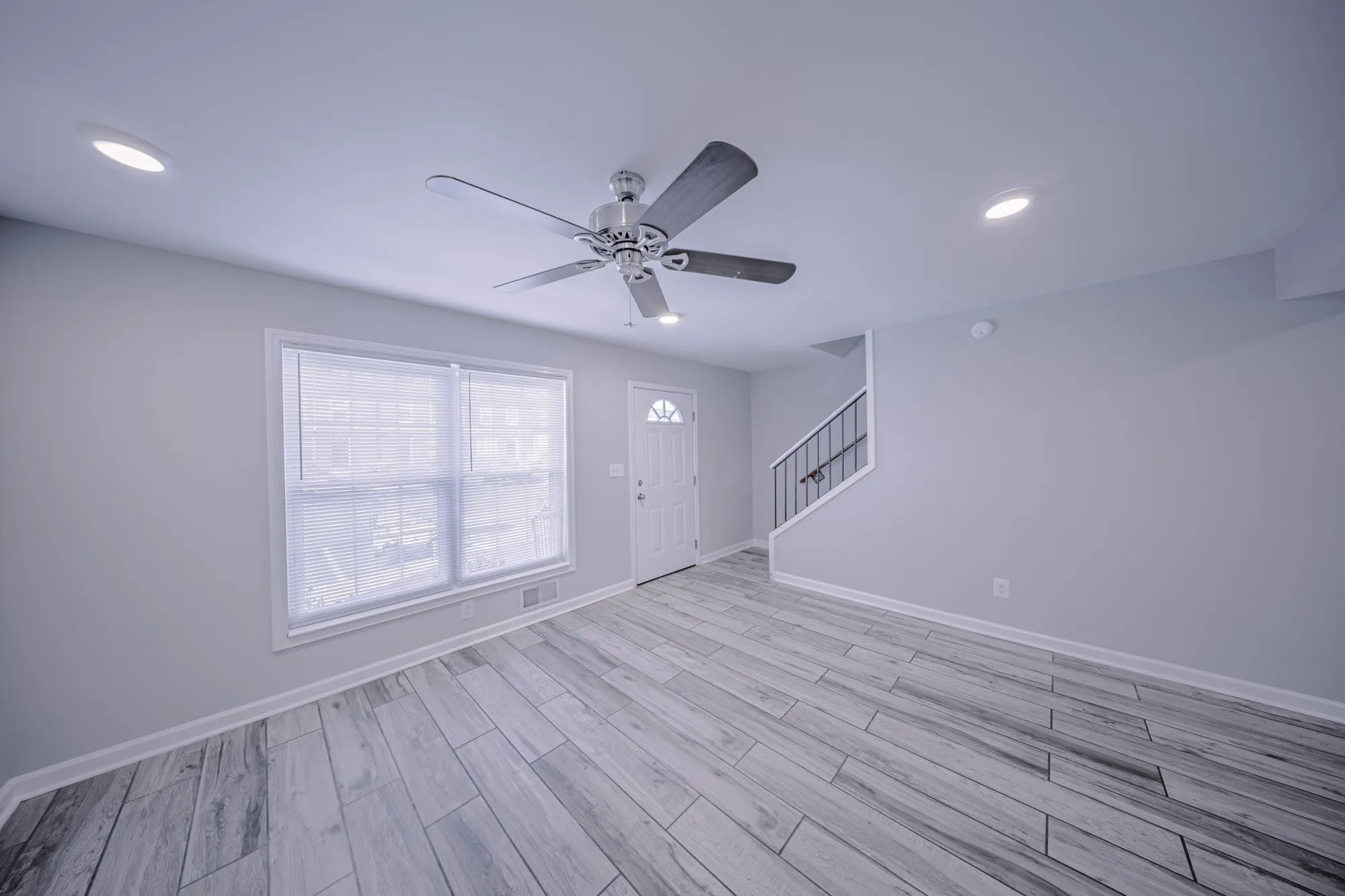Open-plan living area with ceiling fan at The Ridge Apartments in Marietta, GA