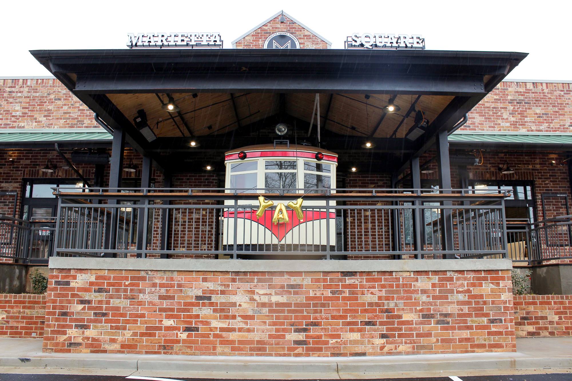 Brick Railroad Museum exterior entrance of The Ridge Apartments leasing office in Marietta, GA