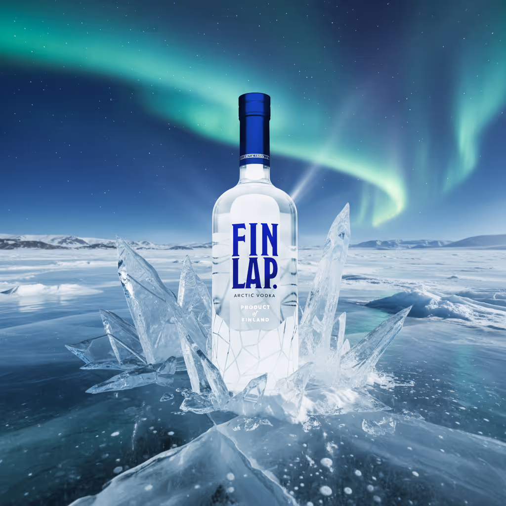 A bottle of Finlap Arctic Vodka surrounded by ice crystals on a frozen lake under the northern lights.