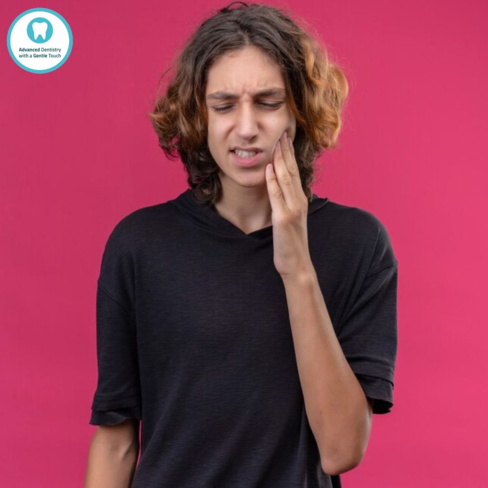 A boy suffering from TMJ symptoms