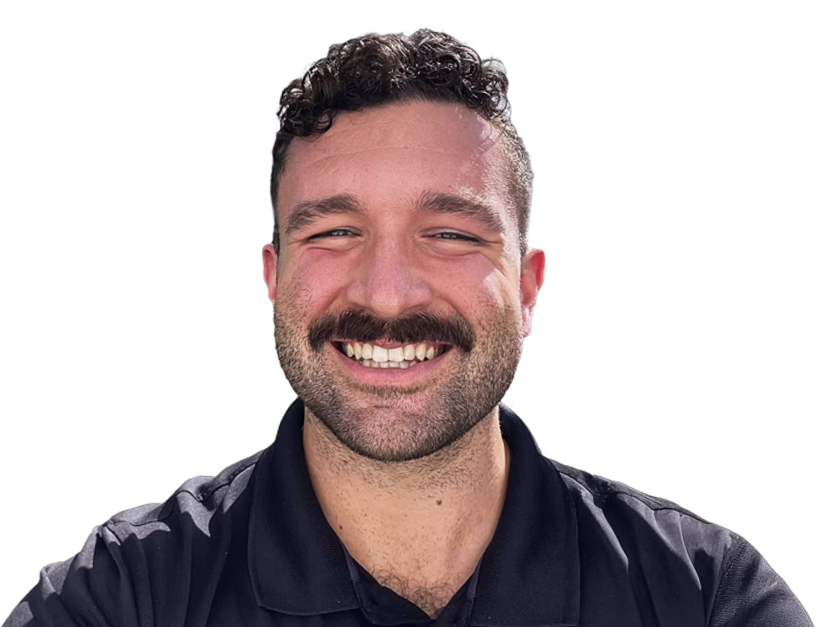Dr. Zach smiling in a black polo shirt