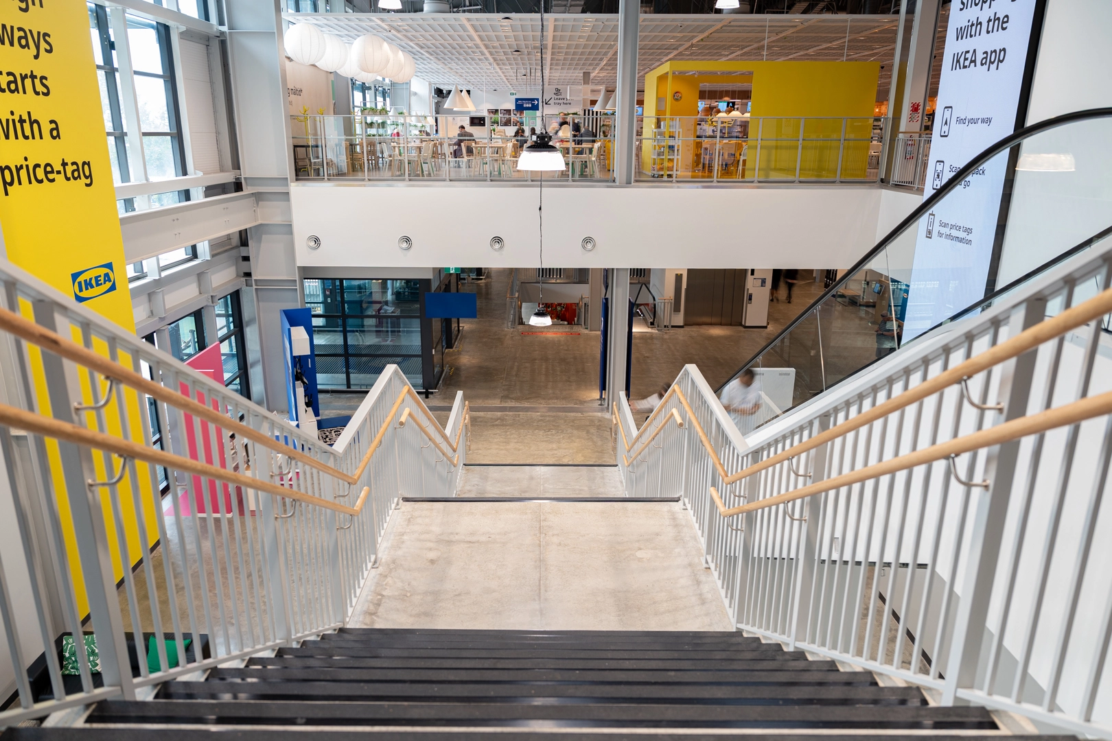 Attache balustrade and aluminum handrails lining an interior IKEA staircase