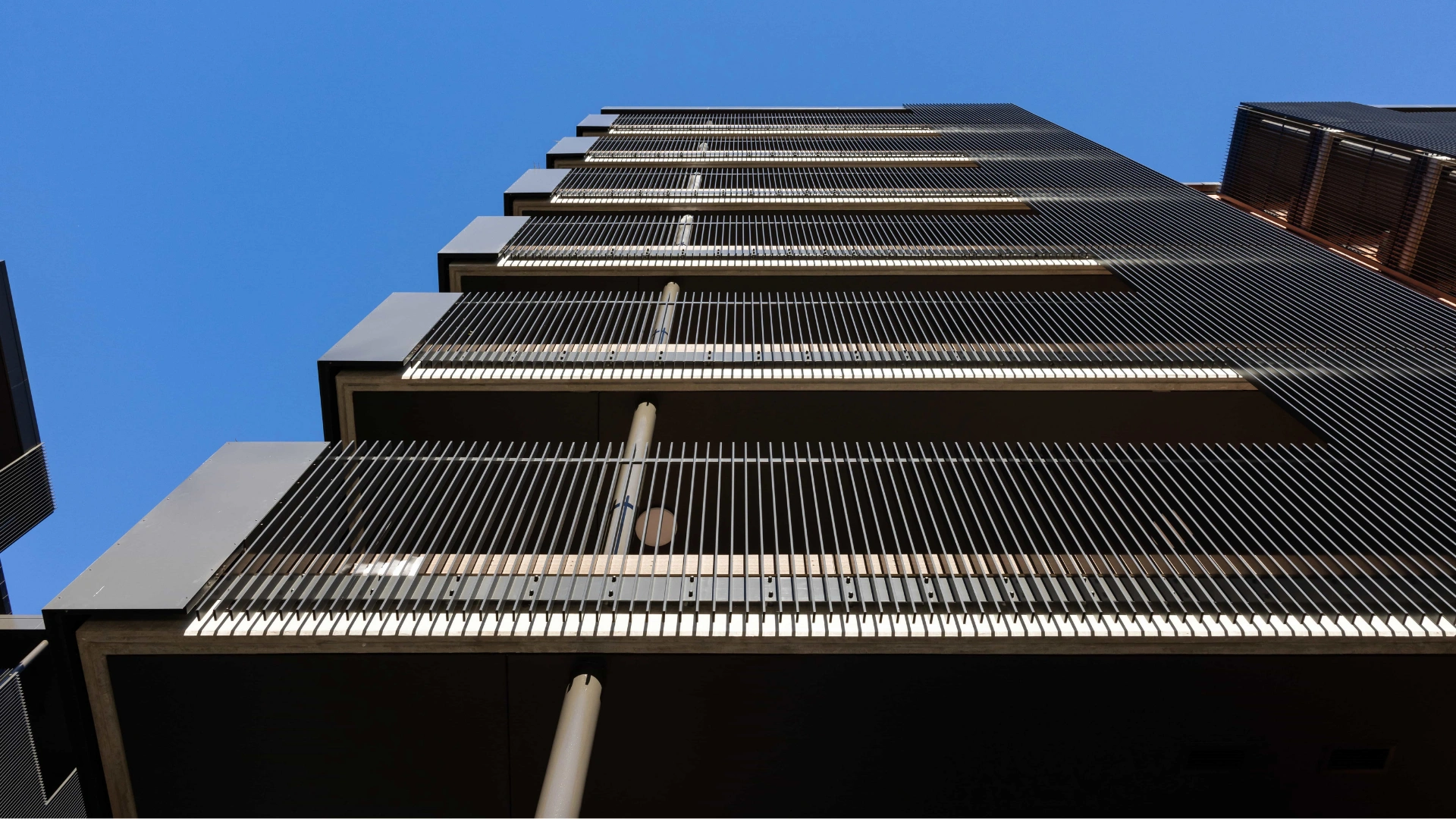 Affinity architectural balustrade with slim vertical aluminium fins on a modern apartment building