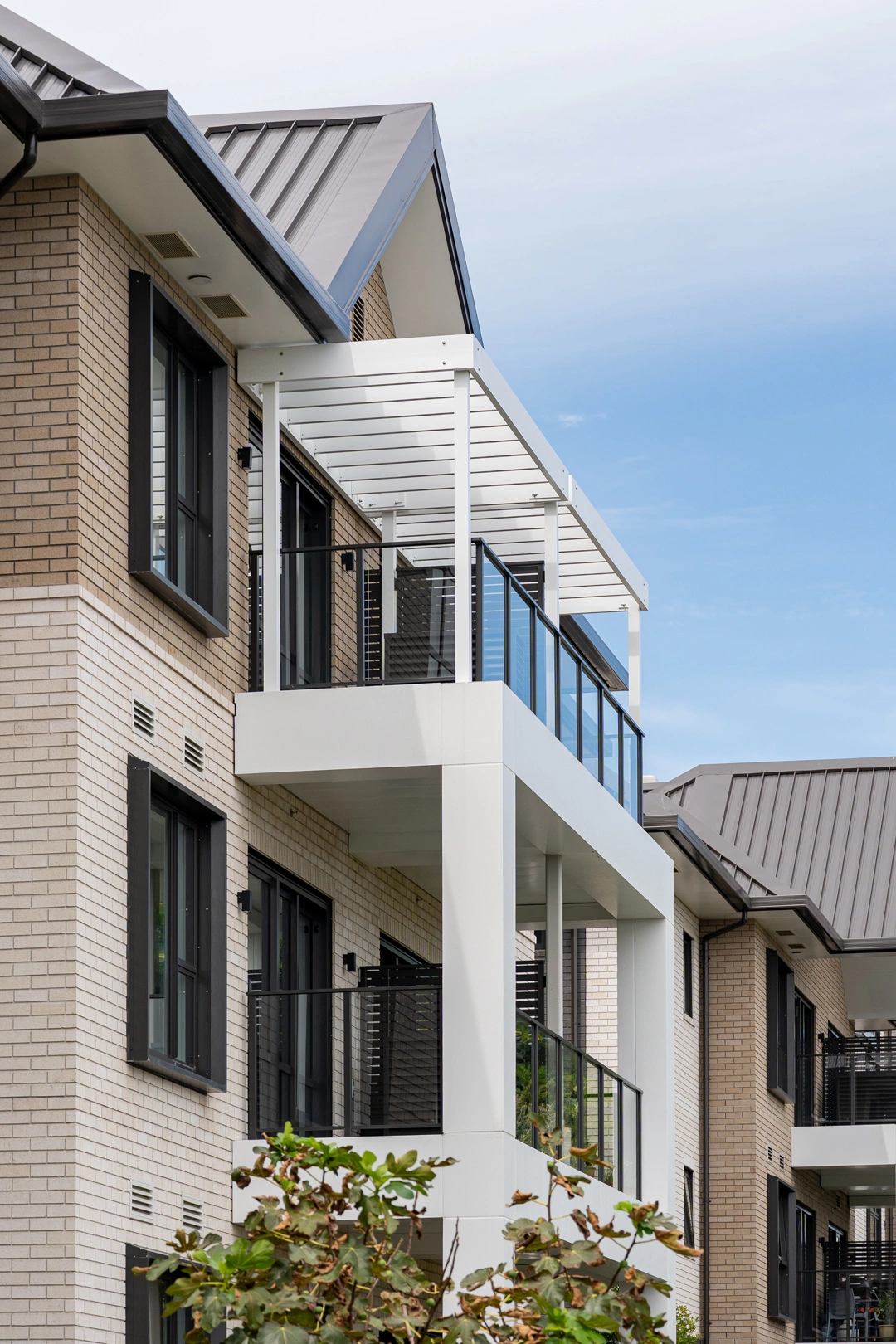 Belcanto Grappler Slide-On balconies on a modern multi-storey residential building