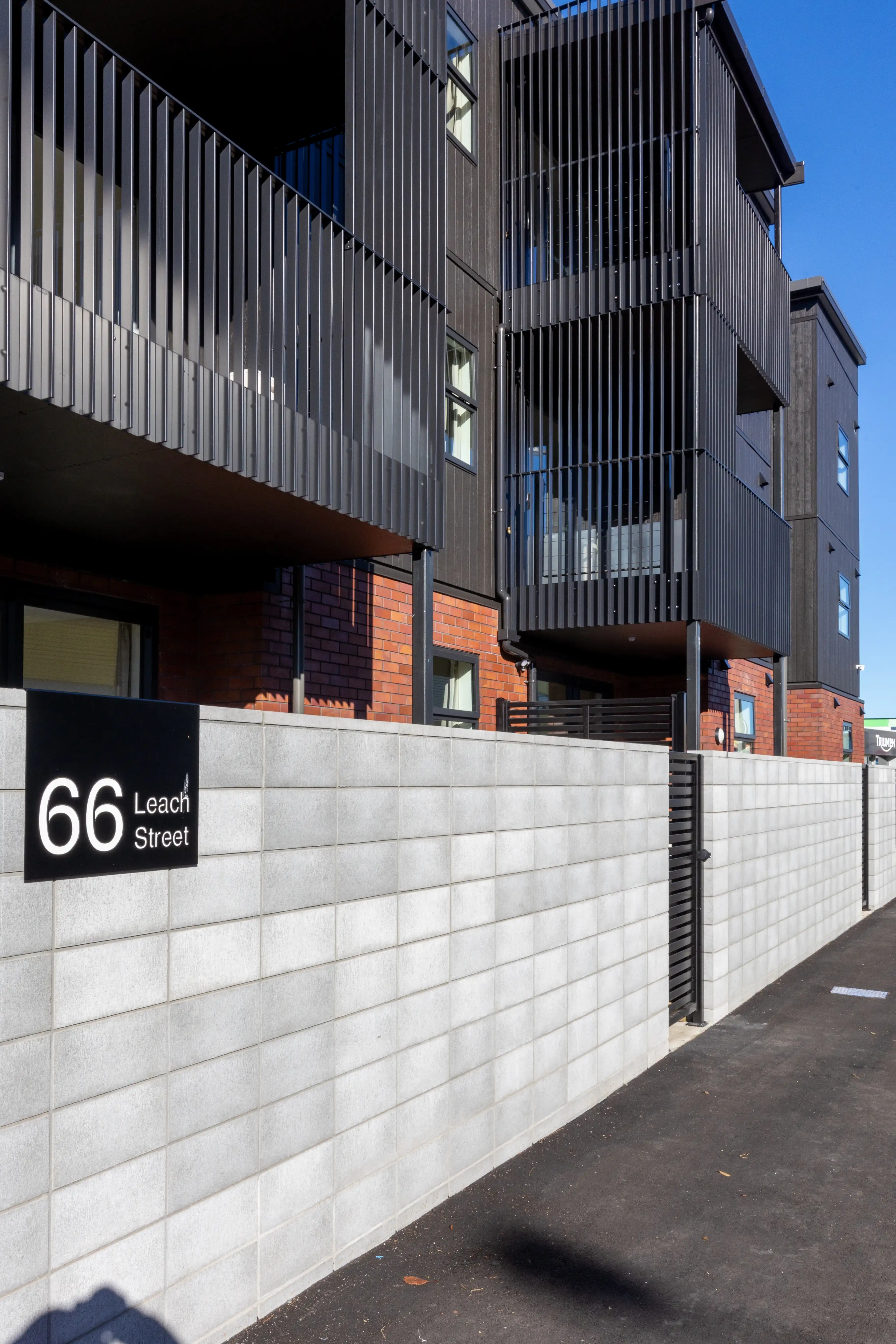 Belcanto Grappler Stack-On balconies installed on a contemporary residential building