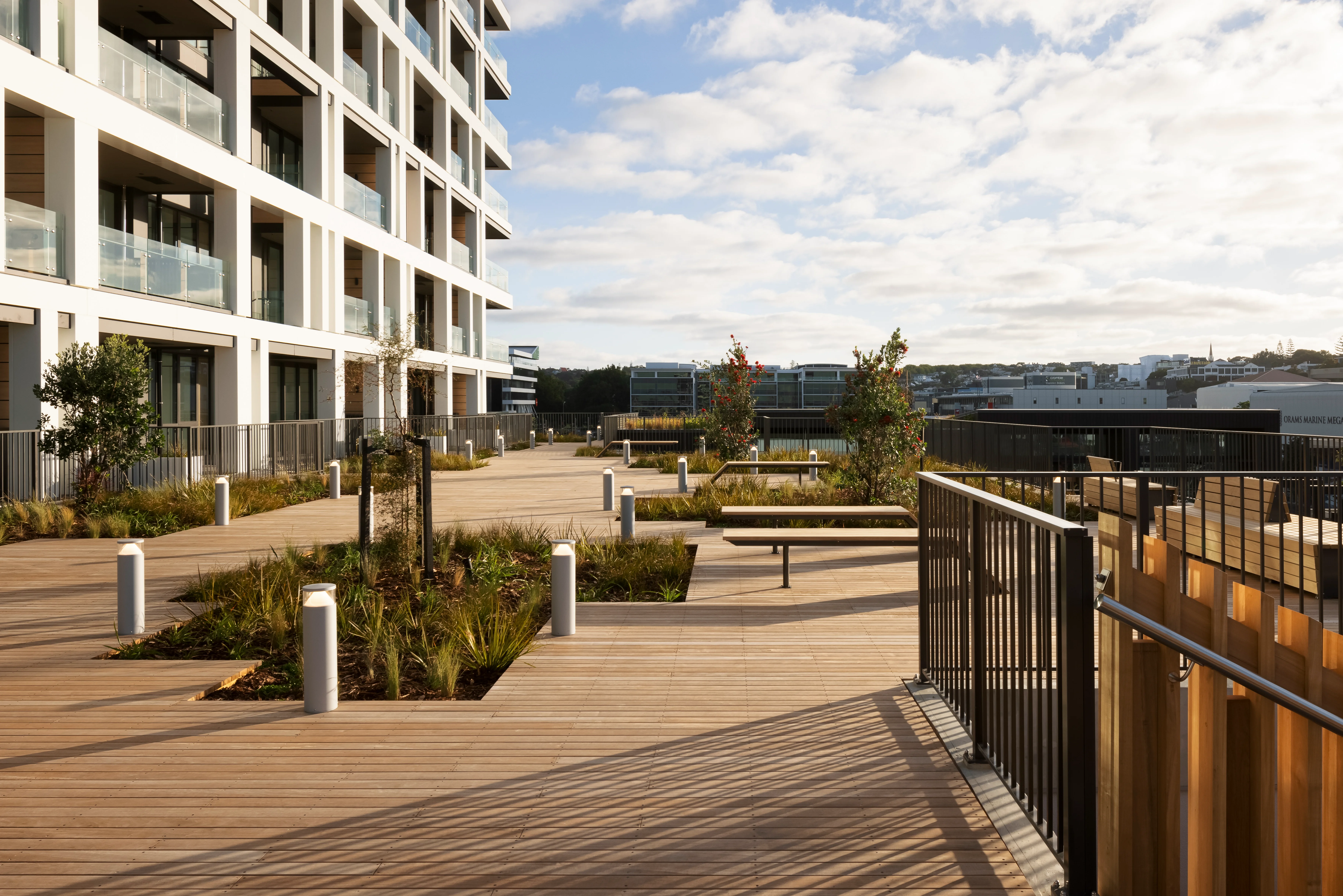 Terrace stairway by Belcanto overlooking the marina, framed by black Attache Balustrade in Alliance Style.