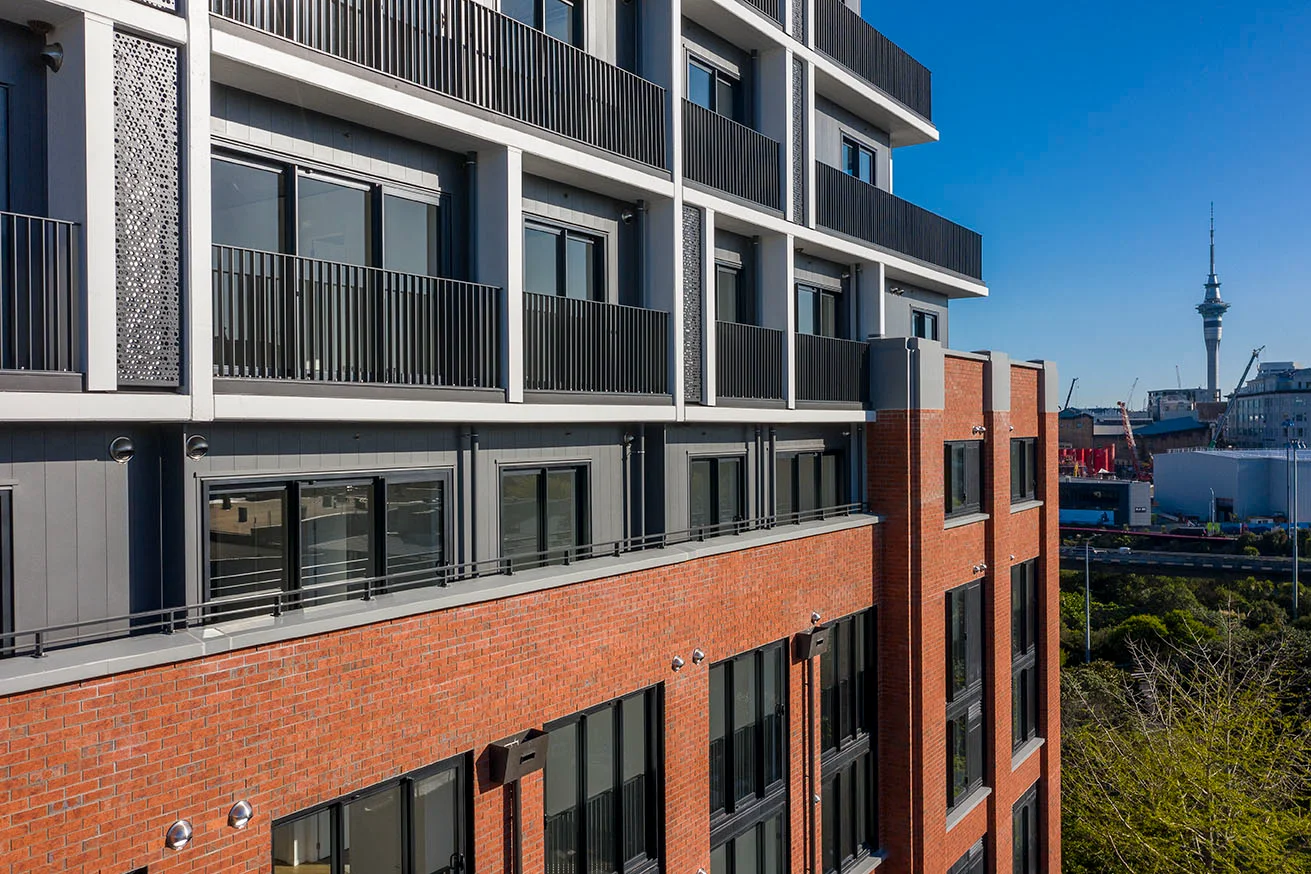 Multi-storey residential development featuring black balcony balustrades by Belcanto