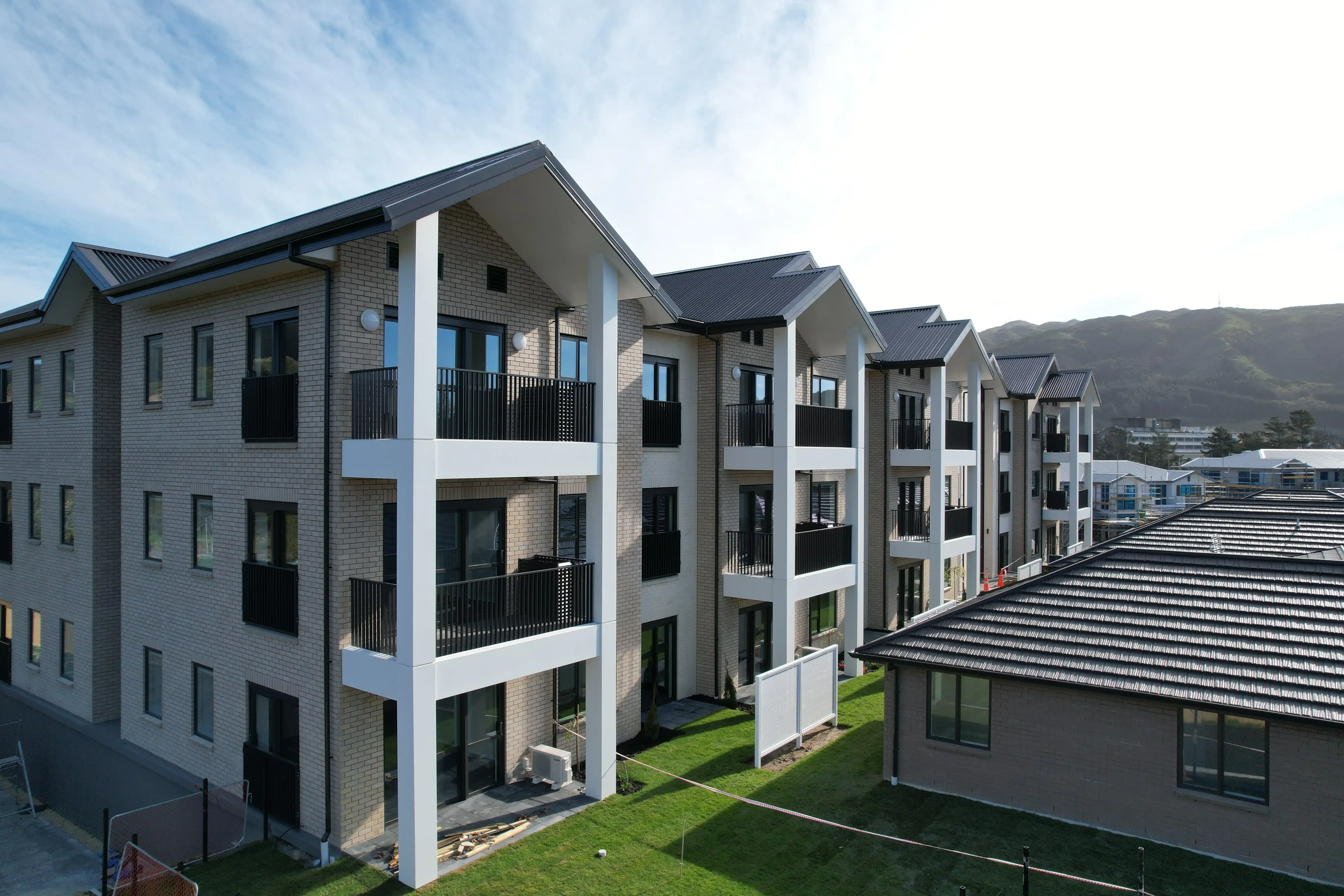 Stacked Grappler balconies with vertical balustrades on a Summerset Kenepuru apartment building