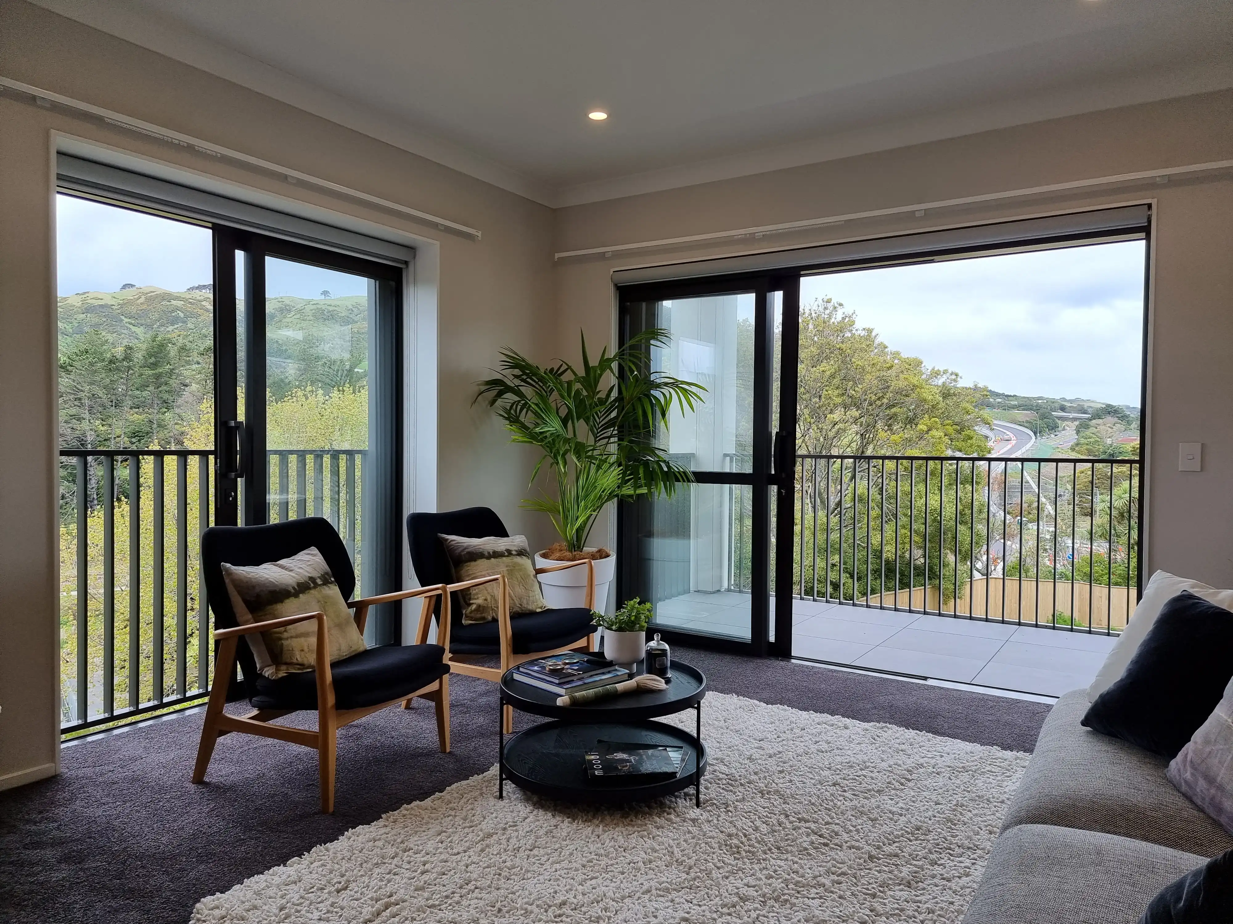 Resident's view from a Grappler balcony through a vertical balustrade at Summerset Kenepuru