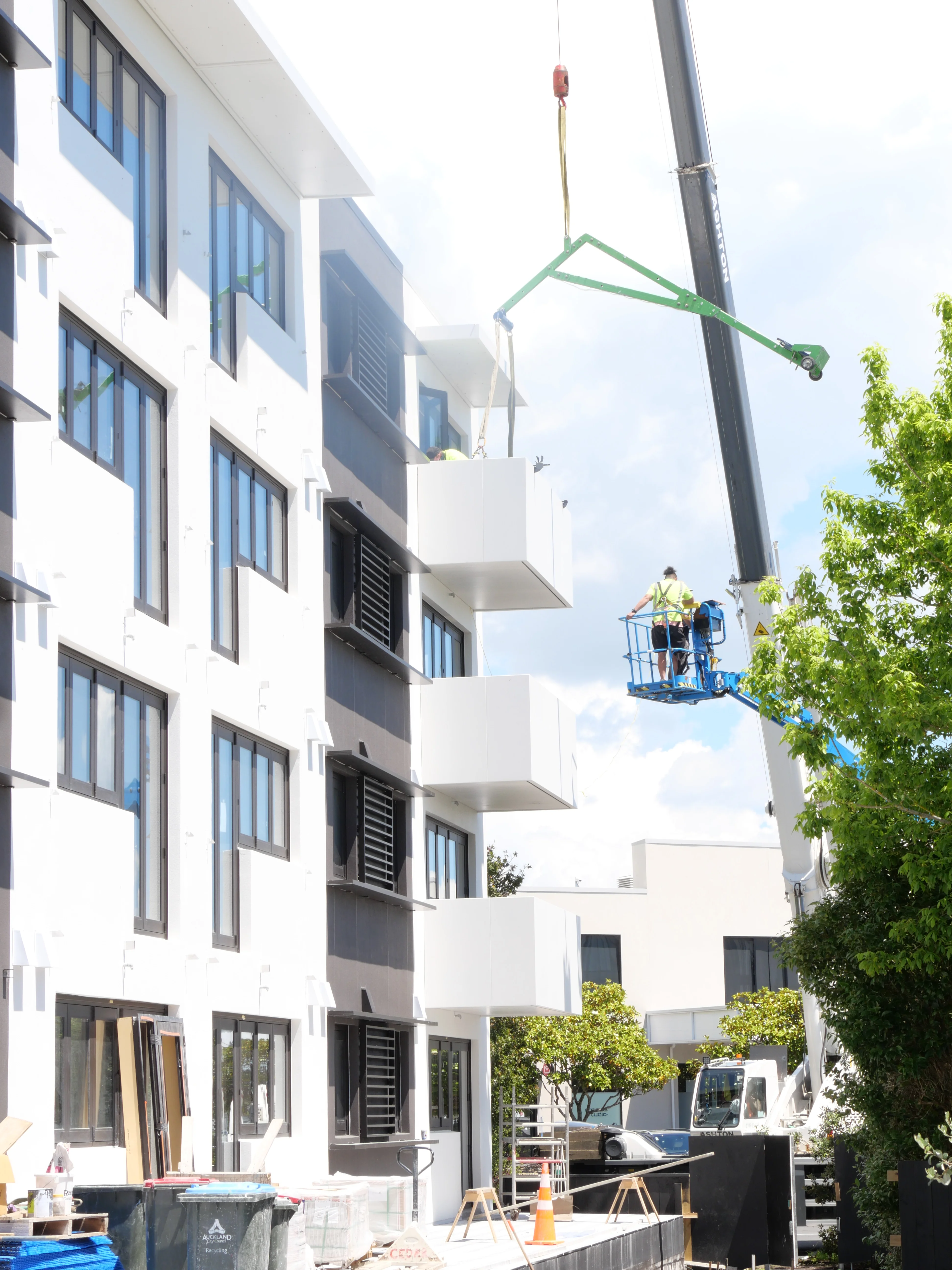Installing prefabricated balconies on a tight Mission Bay site without a tower crane or full scaffolding