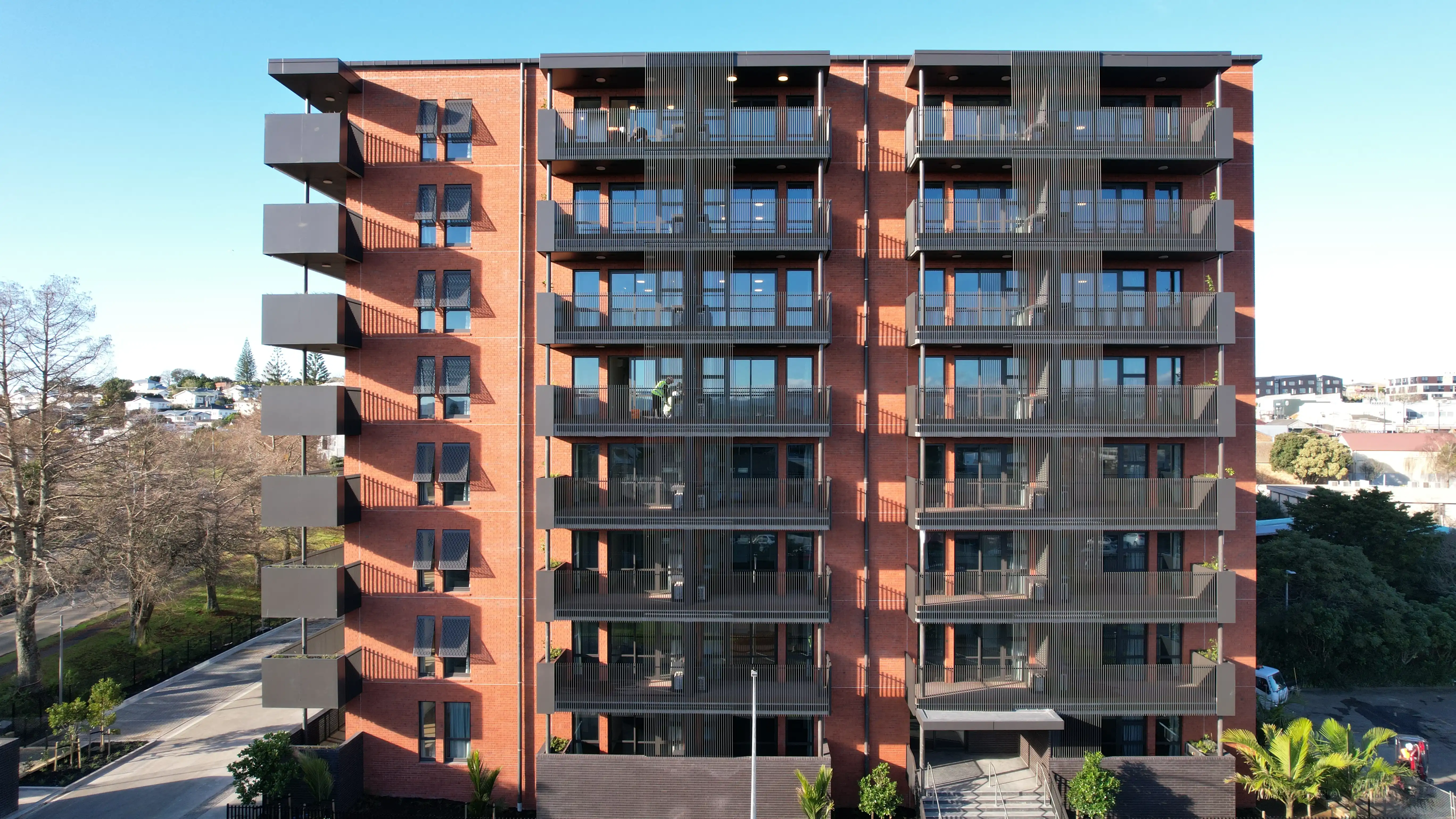 Community Lane in Avondale, Auckland, where five apartment buildings share Attaché Affinity balustrades and screens.