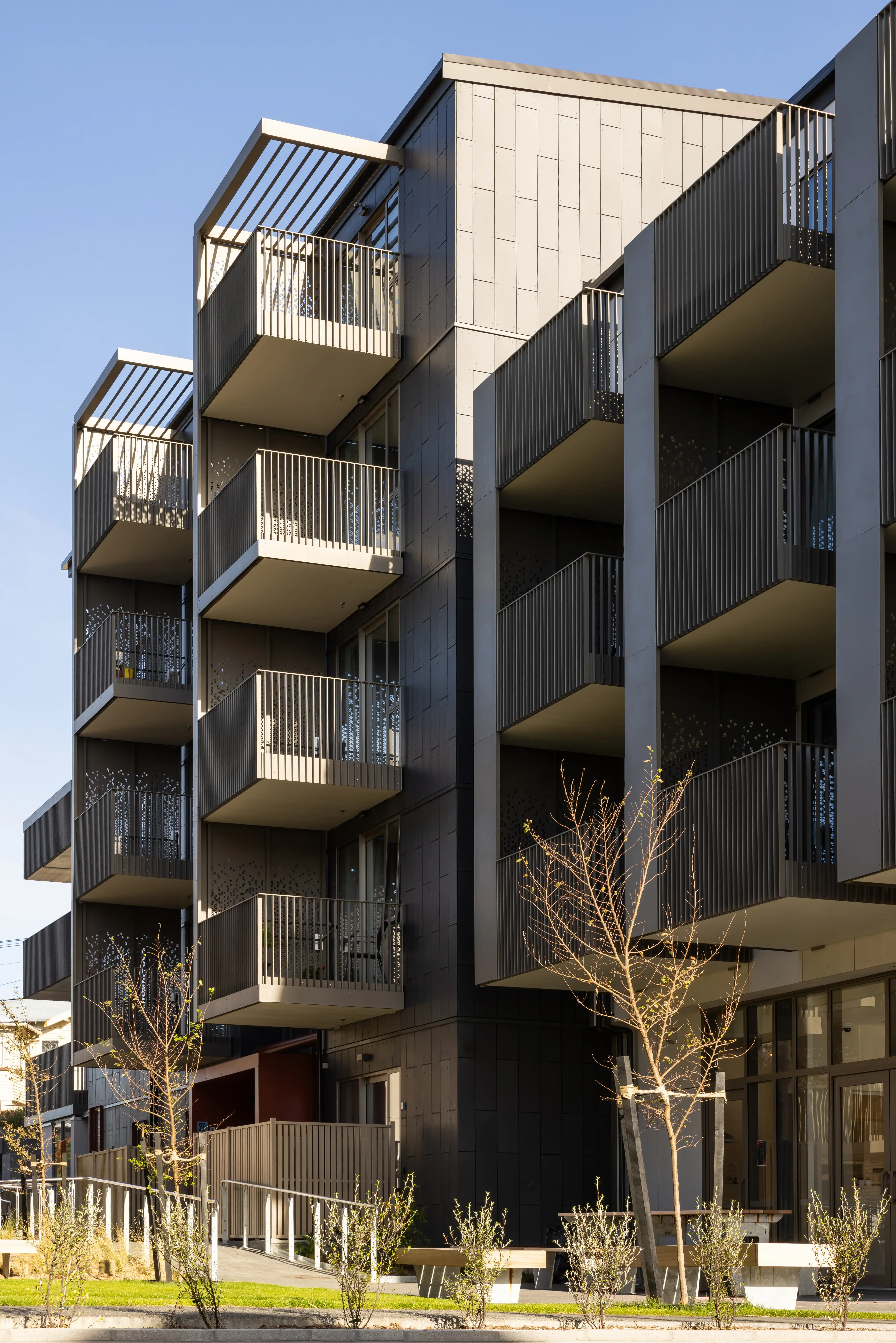 Five-storey steel and concrete block at Te Ō, Wellington, layered with prefabricated Grappler balconies.