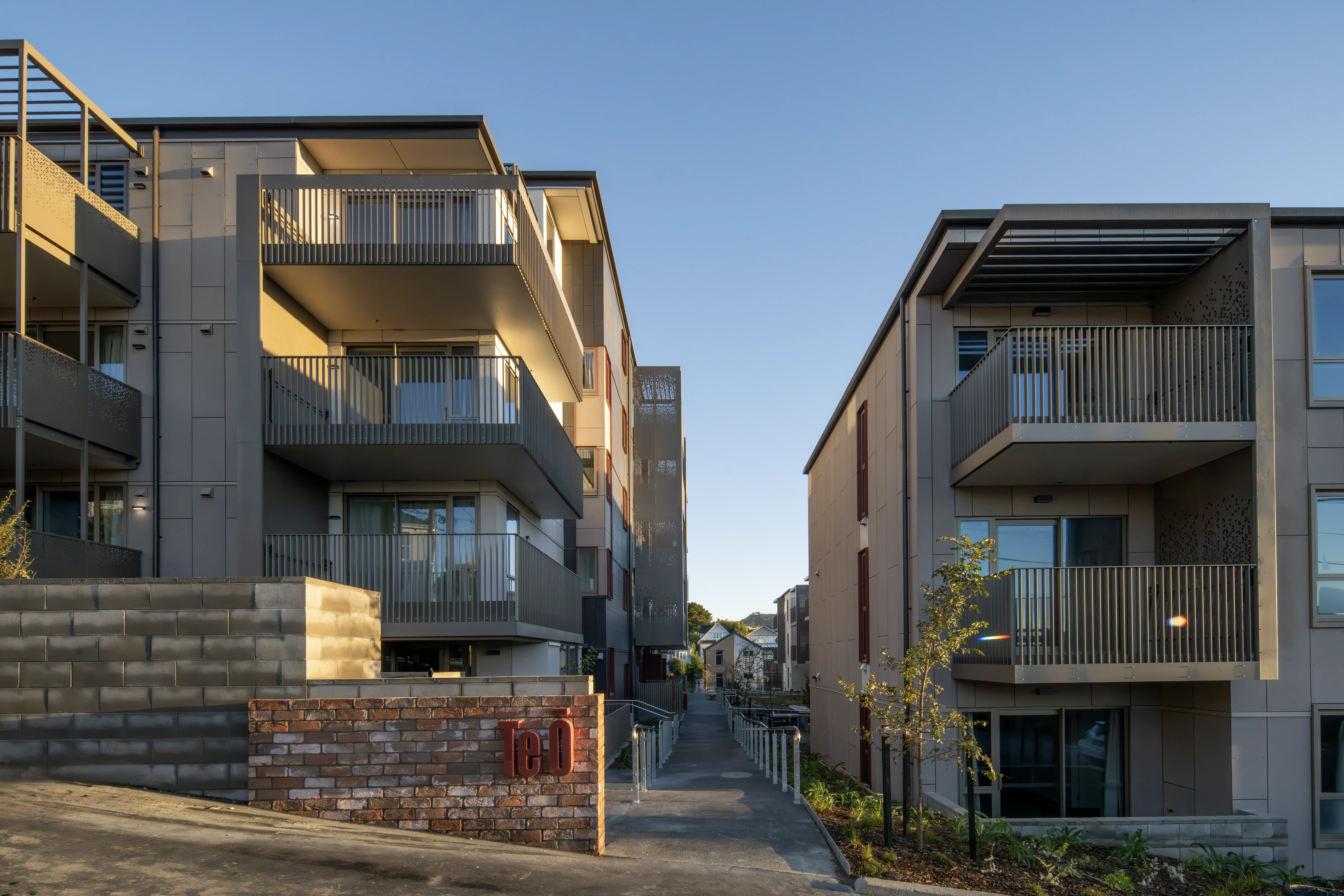 Five-storey steel and concrete block at Te Ō, Wellington, layered with prefabricated Grappler balconies.