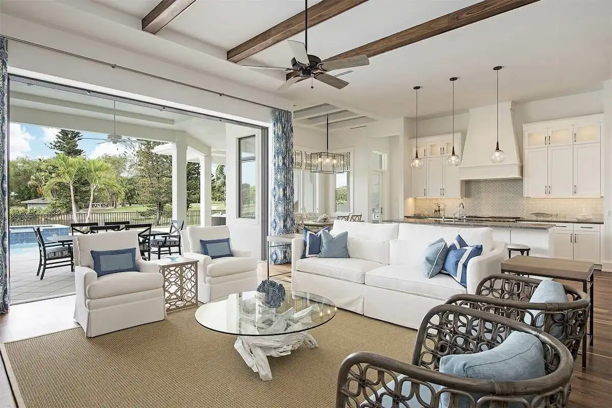 High-end Palm Beach home renovation with open-concept living room, custom kitchen, and seamless indoor-outdoor connection designed and built by Rheace Contracting.