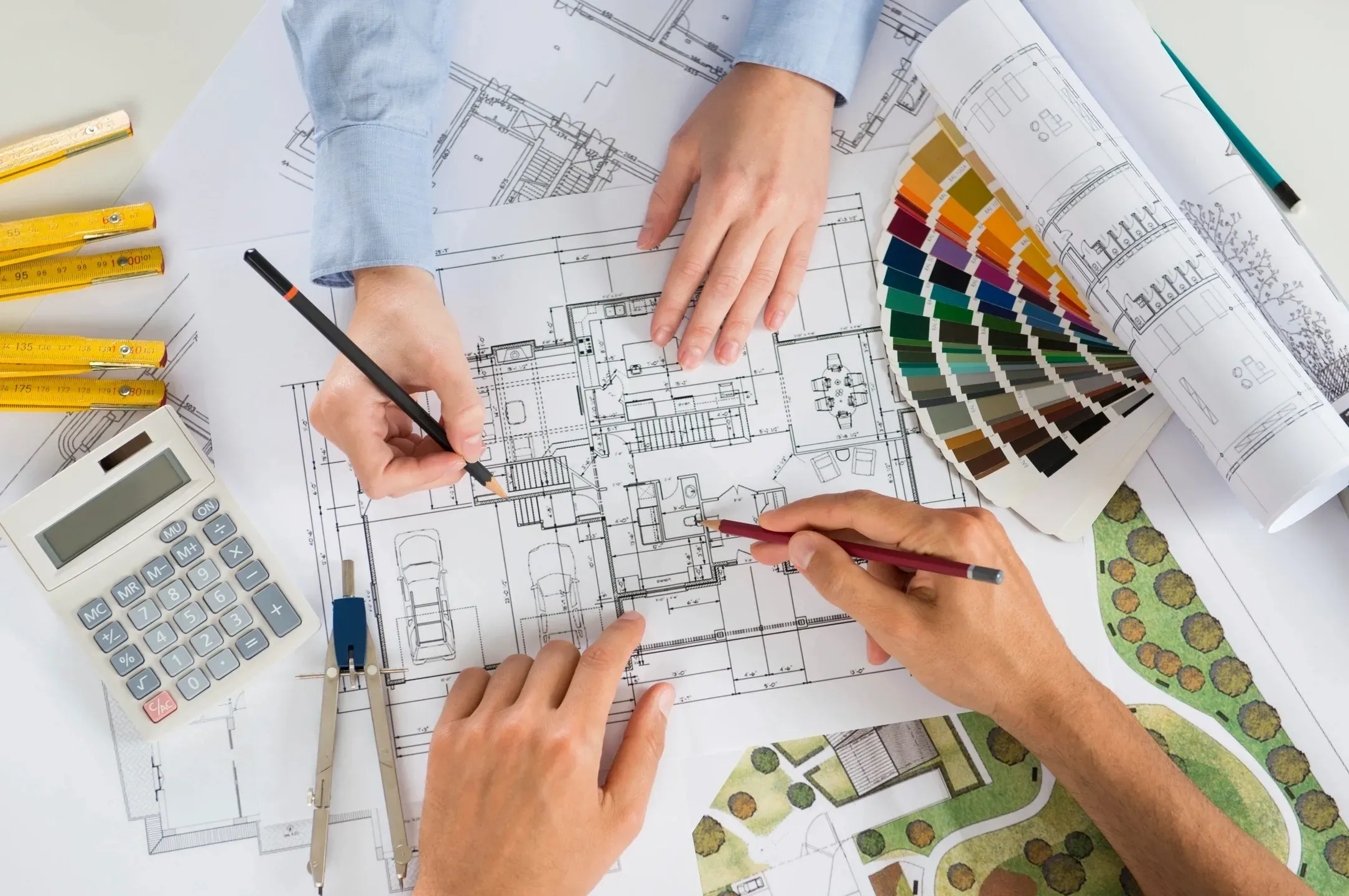 Pre-construction advisory in South Florida showing architectural plans, material selections, and budgeting consultation for luxury custom homes by Rheace Contracting.