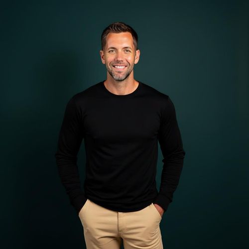 Contemporary luxury kitchen with walnut cabinetry, built-in wine cooler, white upper cabinets, quartz countertops, and Wolf appliances — designed and built by Rheace Contracting in Palm Beach County.