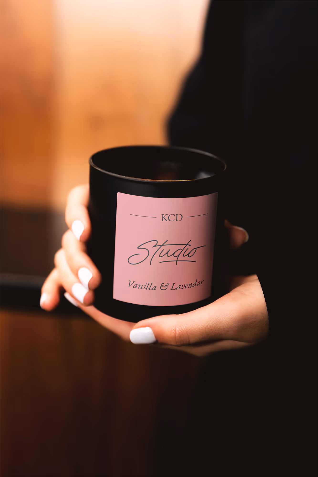 woman holding a candle with custom label 