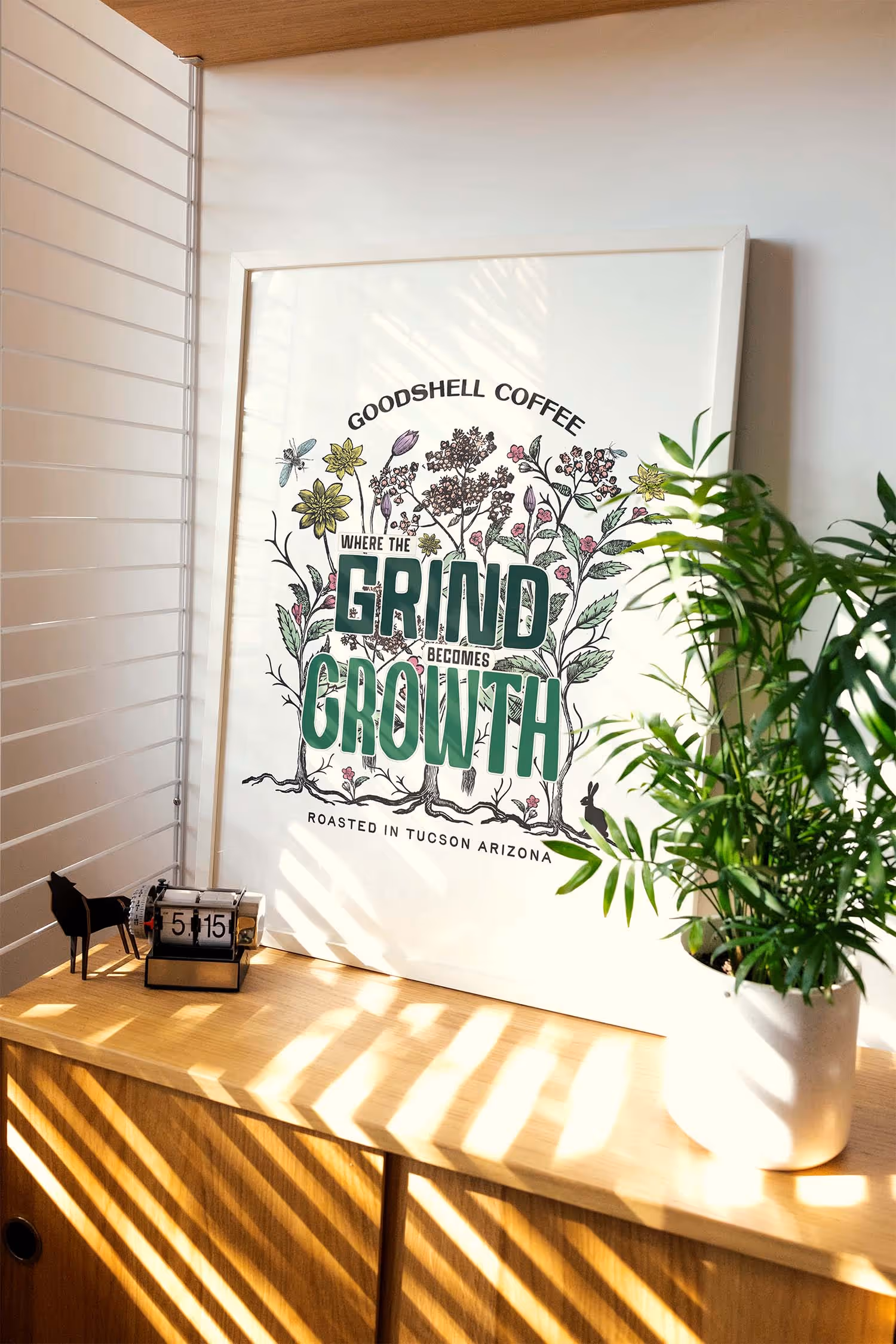 poster on table next to window with soft lighting