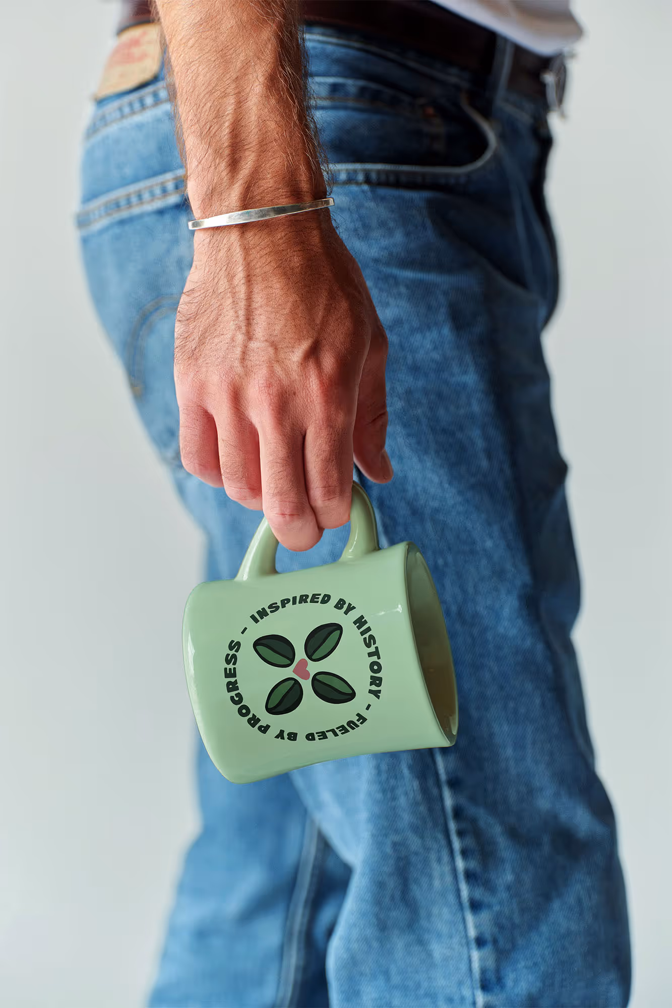 man holding a graphic coffee mug